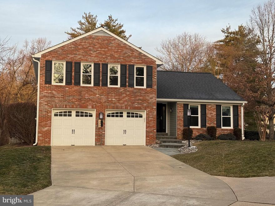 Offer deadline is Tuesday, January 20, at 6 pm!  Welcome to this beautifully updated 4-bedroom, 2.5-bath brick split-level home tucked away on a quiet cul-de-sac in the highly sought-after Village of Hickory Ridge. From the moment you arrive, you’ll be impressed by the elegant flagstone walkway leading to the front door and the classic brick façade that gives this home timeless curb appeal.

Inside, the freshly painted interior is bright, clean, and move-in ready. The heart of the home is the expanded gourmet kitchen and sun-filled breakfast room, thoughtfully added along the rear of the house to create a wonderful space for everyday living and entertaining. The kitchen opens to the backyard and stone patio, making indoor-outdoor living effortless.  The kitchen then overlooks the large sun-filled family room reaturing floor to ceiling windows, and adjoining a separate laundry room with an entire wall full of convenient built in storage space.

The major systems have been updated for peace of mind, including a new roof, HVAC and hot water heater in 2024, along with previously replaced windows and siding, and a gas fireplace—a perfect focal point for cozy evenings.  Note:  When the gas fireplace was installed, the gas line was also run to the stove/oven area.

The fully fenced rear yard isn't huge, and it backs to open space, trees, and a tot lot, offering beautiful views, the feeling of wide open space with the luxury of less yard to maintain, and then the rear patio provides a lovely setting for outdoor dining and relaxation. A two-car attached garage, spacious bedrooms, hardwood floors, and flexible lower-level living space complete the home.

All of this is set in one of Columbia’s most desirable neighborhoods, close to trails, schools, shopping, and community amenities. With its combination of updates, location, and outdoor space, this home truly offers the best of Hickory Ridge living.