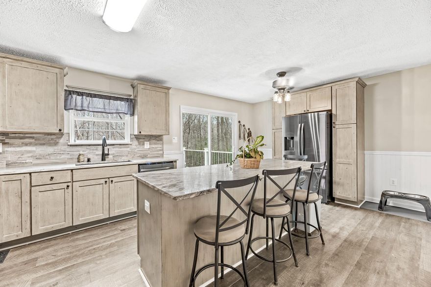 OFFERING CLOSING COST ASSISTANCE. Priced to reflect current market conditions—Best value in the area at this price point- don't miss this opportunity! This home checks all the boxes. Featuring 4 bedrooms and 2.5 bathrooms, this well-maintained home offers the perfect blend of space, comfort and updates. The large, updated kitchen is ideal for both everyday living and entertaining, complemented by new carpet, new luxury vinyl plank, and fresh finishes throughout.  The fully finished lower level provides a spacious rec room- perfect for home gym, entertaining, or additional living space, and a large 4th bedroom. Step outside and enjoy the private back yard that is backing to land that is managed by ACLT land trust.  Recent major updates include a new roof (2023), water heater (2022), and water tank (2019), offering added peace of mind. The property is walking distance from hiking trails, making it ideal for outdoor enthusiasts, as well as close to shopping and restaurants. Roof on the shed is new.  HOME WARRANTY THROUGH FEBRUARY 2027 INCLUDED.