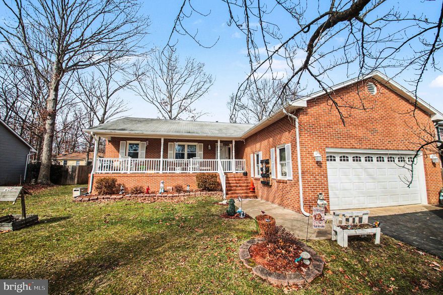 Welcome to 5403 Cedar Ridge Drive, a well-maintained brick ranch-style residence situated on a generous lot in a highly desirable location close to everything! This inviting 3 bedroom, 2 full bath home offers a seamless blend of comfort, functionality, and everyday living. Begin your mornings or unwind in the evenings on the charming front porch—an ideal setting for quiet relaxation.

Step inside to discover gleaming hardwood and laminate plank flooring leading to a spacious family room that serves as the heart of the home, highlighted by a cozy wood-burning fireplace—perfect for gathering on cooler evenings. The floor plan also features a separate dining room and foyer, providing comfortable spaces for entertaining and everyday living. The kitchen is thoughtfully designed with enough space for an eat in kitchen table, showcasing granite countertops and modern stainless steel appliances, including a refrigerator, dishwasher, and gas range, making meal preparation both efficient and enjoyable.

The primary suite offers a peaceful retreat with a walk-in closet and a private full bath featuring a vanity, and a tub/shower combination. Two additional bedrooms share a second full bath with a walk-in shower conveniently positioned for guests or family use. A main-level laundry room with utility sink and additional storage enhances daily convenience.

Outdoor living is equally appealing, with a welcoming large deck ideal perfect for all the family and friends gatherings. The fully fenced backyard provides ample space for pets, play, and outdoor entertaining, and includes a storage shed for added functionality. A paved driveway and attached two-car garage offer abundant parking and storage.

Conveniently located near shopping, dining, the VRE, I-95, and more, this home delivers an exceptional combination of comfort, accessibility, and practicality. Schedule your tour today and experience the ease of living at 5403 Cedar Ridge Drive.