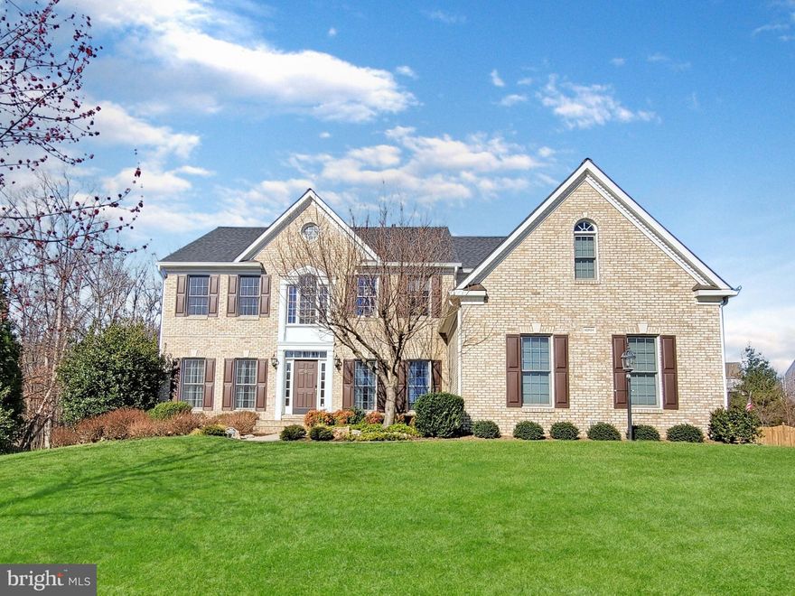 Welcome to your dream home! Located in the coveted estate community of Forest Manor, this luxurious 3 car garage home offers a blend of comfort, elegance, and natural beauty. Nestled on a generous half-acre lot on a cul-de-sac, this stately home backs to woods, a stream and a certified wildlife habitat ensuring unparalleled beauty and tranquility. A private inground saltwater pool is surrounded by a large patio, providing the perfect setting for leisurely swims and outdoor gatherings. A recently replaced deck overlooks the pool and professionally landscaped fenced yard. An in-ground irrigation system keeps the lawn lush and green, maintaining an idyllic retreat for relaxation and recreation.
 
Inside the home, you’ll find Exotic Brazilian Koa Hardwood floors throughout the main level. You’ll see fresh modern paint colors throughout, and a two-story family room with gas fireplace and large windows that offer picturesque views of the surrounding greenery.

The gourmet kitchen features high-end stainless appliances (Viking Fridge & Cooktop, Bosch dishwasher) and new sleek quartz countertops, 42” maple cabinets and a walk-in pantry, making it a chef's dream. The kitchen flows seamlessly into the living areas, creating an open and inviting space for gatherings and entertaining.

The sunroom off the kitchen offers more views of the private backyard & pool, and provides a cozy space to read or enjoy a cup of coffee. The main level also features an office, living room, dining room, powder room and two sets of hardwood stairs leading to the upper level, where hardwood floors continue throughout the upper hall & all four bedrooms.

The large owner’s suite is a relaxing haven with a sitting area, huge bathroom, and jetted soaking tub. The owner’s suite also features two custom closets including one that fashion enthusiasts will surely desire! On the same floor are three other sizeable bedrooms, one with an updated ensuite bathroom, and the other two bedrooms share an updated Jack & Jill bathroom. 

On the walkout lower level you will find even more living space including a large rec room with hardwood floors, a 5th bedroom, full bathroom, media room and a den. There is also a rough in for a wet bar, and plenty of additional storage space.

This lovely home offers both privacy and convenience, allowing you to enjoy the tranquility of nature without sacrificing accessibility to shopping and services and the nearby metro station. Whether you're relaxing on the deck, taking a dip in the pool, or exploring the wildlife from your backyard, this luxury home offers a truly exceptional living experience, where every day feels like a retreat!