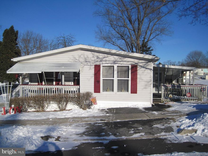 Very nice, well maintained 2 BR, 2 Bath, double wide in Pin Oak Park!  Move in ready featuring: Den with built-in cabinets & book cases, attractive kitchen with lots of cabinets & counter space, spacious master bedroom suite with newly remodeled bath & walk-in closet, sunroom, covered back porch with swing, newer roof, 2 sheds with electric, new hot water heater, replacement windows, well insulated 2x6 exterior walls, corner lot, & all appliances stay. Affordable housing with low utility costs, don't miss it!