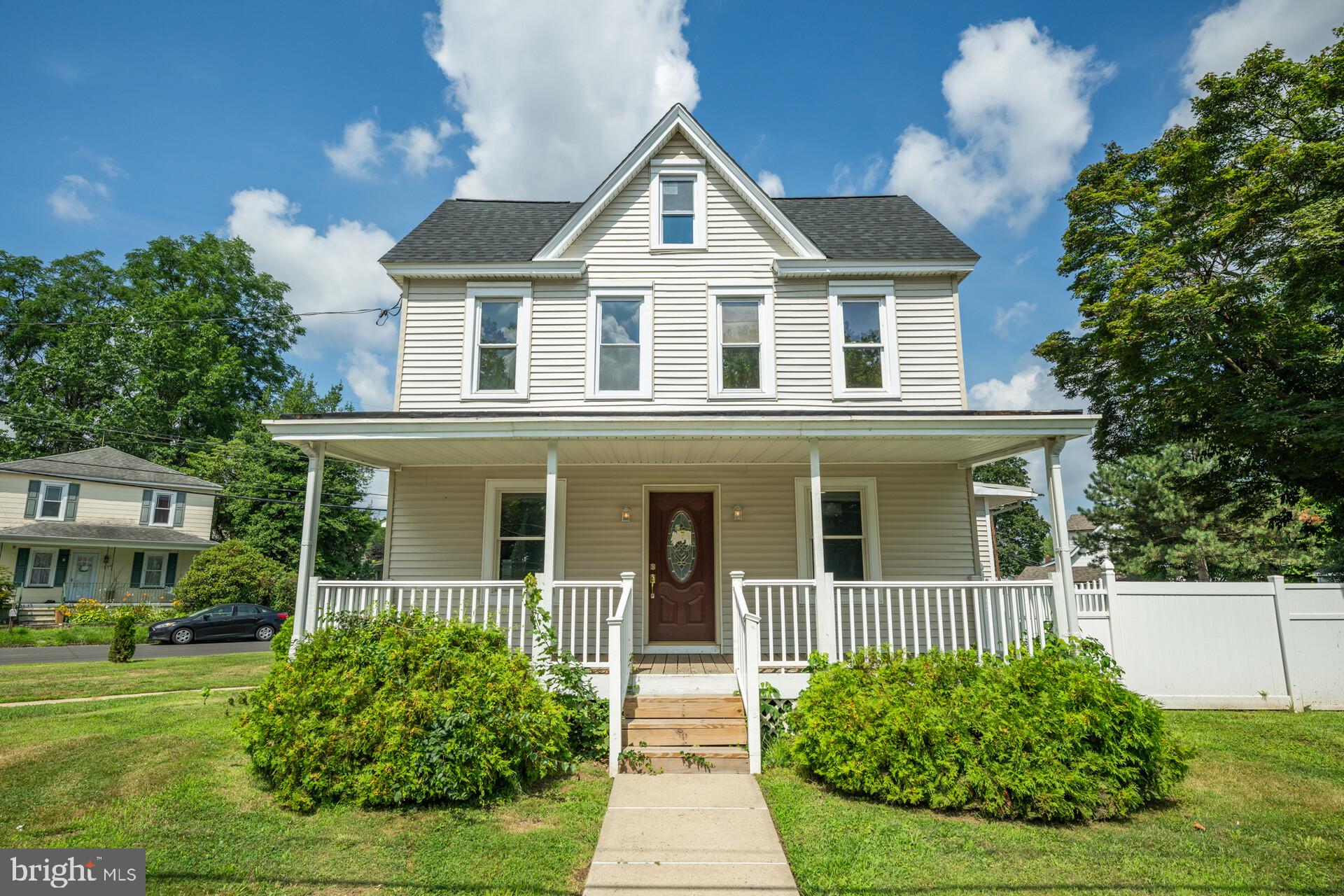 Welcome home to this gorgeous historic home in Bristol Township! This one of a kind Victorian with more than 2,600 sq ft has been completely remodeled with a finished attic and potential for multi-family living with an in-law suite. As you approach the home, you step on to the large front porch. Entering the home, you are greeted with a spacious living room featuring a large bay window. The first floor boasts updated luxury vinyl plank flooring throughout. The completely remodeled kitchen with granite countertops and tile backsplash features an island with waterfall edge, new cabinets, and all new stainless steel appliances. Step downstairs to the den/in-law suite area with a side entrance and full bathroom as well as a slider to the large backyard. The den/in-law suite with fireplace is a separate living quarters and could be used as another gathering space or guest room. On the second floor you have three ample sized bedrooms with a fully updated bathroom and walk-in shower. The renovated finished third floor attic can serve as the fourth bedroom or other multifunctional space. Your outside oasis on this large corner lot has a new paver patio and is completely fenced in. It's just waiting to be landscaped for seasonal entertaining! New roof, electrical, plumbing, water heater, AC mini-splits, and kitchen remodel all in 2024. New upstairs windows replaced in 2025. Conveniently located near many restaurants, shops, and all major highways. Also located near charming historic Bristol Boro. Don't miss your opportunity to see this beauty, schedule your appointment today!