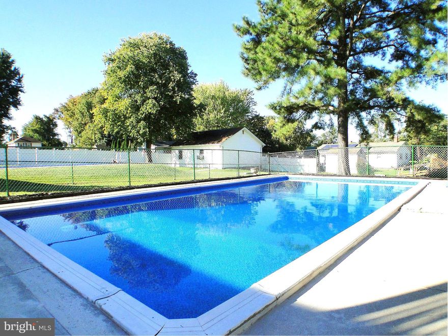 BACK WITH IMPROVED PRICE! Spacious Split Foyer style home situated on over 1/4 acre fenced-in lot with relaxing in-ground pool. Recently remodeled kitchen with granite counters, potential 4th bedroom on lower level. Newly resurfaced driveway, ample parking w/Carport, newer windows, newly remodeled hallway and master bathrooms. Home warranty included. Sellers not required to have flood insurance.