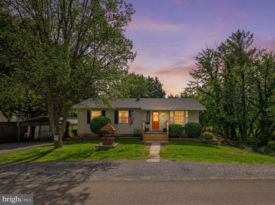 NO HOA! Ideally located just 1/2 mile from Interstate 81 and less than 10 minutes to Winchester, VA, this charming 3-bedroom, 1.5-bath home offers the kind of convenience buyers are looking for—paired with the privacy and freedom of an unrestricted lot.

Whether you're a first-time homebuyer, commuter, or someone looking for a peaceful setting with practical updates, this property is one you will want to see. Enjoy the beauty of the outdoors with a stream in the backyard, a large wraparound deck perfect for relaxing or entertaining, and a new front porch with railings added this year to enhance the home’s curb appeal.

The partially fenced yard adds even more functionality for outdoor enjoyment. Inside, you’ll find a comfortable layout with updated features throughout. The kitchen offers updated flooring and stainless steel appliances, while the renovated upstairs full bath adds modern appeal. The partially finished basement provides valuable extra space with a half bath, storage, and flexibility for a rec room, office, hobby space, or whatever best fits your needs. Major recent improvements include a new roof, updated plumbing, upgraded electrical panel, high-efficiency gas furnace, and two 120-gallon propane tanks.

The property also features a 2-car aluminum carport complete with lighting and hot/cold water access, adding even more convenience and usefulness. This home combines location, updates, outdoor living, and everyday practicality in one appealing package.