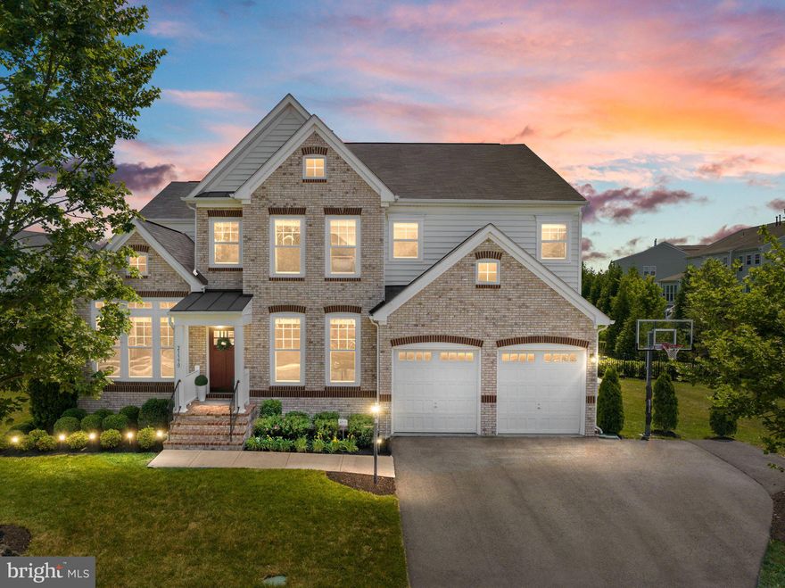 Open House Saturday, 10:00 am - 12 :00 pm and Sunday, 2:00 pm - 4:00 pm. 
A rare opportunity to own this one-of-a-kind gem in the heart of Brambleton. Meticulously maintained by original owners, this spacious property is a luxurious, serene oasis conveniently located in a desirable
neighborhood close to commuter routes. The fenced backyard is a private, delightful retreat boasting a heated saltwater pool and hot tub with waterfall fountains. The tranquil space is beautifully landscaped including a travertine patio and outdoor entertaining area. These resort-like grounds are perfect for al-fresco dining and secluded relaxation. You will never want to leave home while enjoying the 3 season porch with stunning poolside views. Almost 6,000 finished square feet, this sought-after 6 bedroom, 5 bathroom, 3 story, Van Metre home is an entertainer’s dream with an open floor plan. Upon entering the home, the foyer opens to a sizeable dining room on your right and a bright living room on your left. The convenient butler’s pantry provides extra storage. Beyond the living room, a coveted main level bathroom is close to an incredible custom home office including built-ins and a wrap-around desk, easily adapted to a main level bedroom. In the family room, the stunning floor-to-ceiling, lava stone, double-sided, gas fireplace takes center stage. Beautifully appointed, the gourmet kitchen features stainless steel appliances, a gas cooktop, vent hood, double oven, built-in microwave, expansive center island with pendant lights and seating, ample cabinets, pantry, breakfast bar, gorgeous granite countertops and custom backsplash. Bathed in light, the breakfast room is the perfect spot for dining and poolside views. Organization is made easy in the large mudroom off the garage including custom built-in cubbies and a bench. The dramatic dual entry staircase leads to an enormous loft. Relax in the well-appointed primary suite featuring a large bedroom with tray ceilings, a ceiling fan, a sitting room, two walk-in closets, and a spa-like bathroom with a shower, soaking
tub, dual vanities, and water closet. Three additional bedrooms all contain spacious closets and a ceiling fan and a light fixture. Bedroom two is an en suite with a private full bath. Bedrooms three and four share a large bathroom off the hallway. Conveniently located upstairs the laundry room has a washer, dryer, and a sink. High-end finishes welcome you to the opulent basement. White quartz countertops in the kitchen are centered around a sizeable waterfall island. Stainless steel dishwasher, microwave, and beverage refrigerator make this area ideal for large crowds. Exquisite details adorn the focal wall of the recreation room with custom shelves, lighting, and marble tile. An exercise room makes working out readily accessible. Tons of extra space for games and toys abounds. Out of town guests will enjoy the delightful bedroom including an enormous closet. Situated off the rec room is the fifth full bathroom. There is plenty of space in the storage room with a full size refrigerator. Easy access to the backyard paradise through the rear entrance which opens to steps. Past the fence a flat open space in the side yard. Amenity rich and rare Brambleton location, close to Brambleton Town Center with grocery store, restaurants, movie theatre, a health club, coffee shops, doctors, state-of-the-art Brambleton library, farmer’s market. Walk to community amenities including: 4 swimming pool complexes, tennis courts, volleyball courts, ball fields, tot lots, dog park, neighborhood parks, free Little Library Boxes, 18 miles of paved trails, new Metro bus stops. Enjoy many events including concerts and festivals. Brambleton HOA Includes: Community Verizon FIOS Package for Cable and Internet, Pools, Parks, Zip Lining, Swings, Climbing Domes, Tennis Courts, Dog Park, Trails, Bram Intranet, Community Events, Trash and Recycling. 15 minute drive to Dulles International Airport.