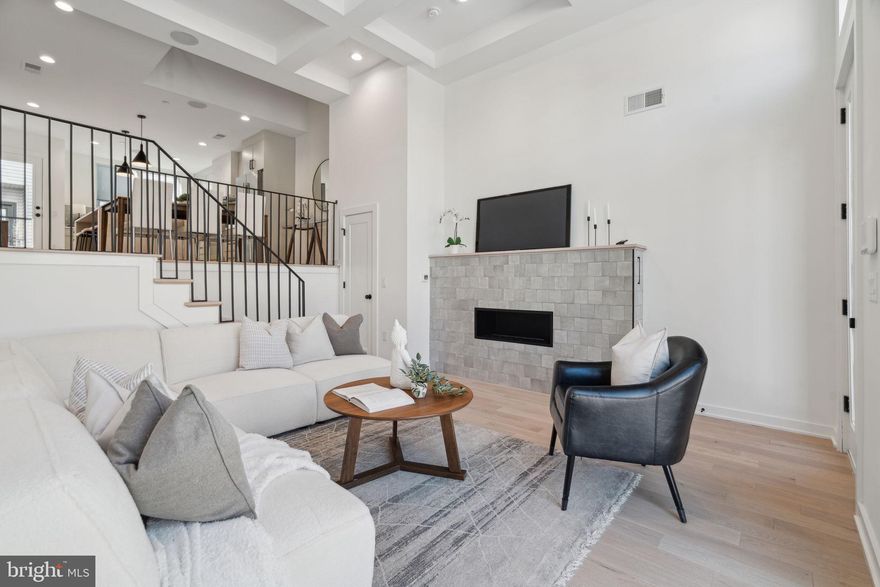 **LAST AVAILABLE UPGRADED UNIT** Welcome to Wendle Place Phase II! 962 Wendle Court is an upgraded unit in the stunning Rag & Bone design package. The home offers 19 feet of width and nearly 3,000 square feet of living space, featuring soaring ceiling heights throughout. With 3 bedrooms, 3 full baths, 2 half baths, 2-car garage parking, multiple outdoor spaces, and private rooftop decks with green roofs, these homes are built to impress. The main living area boasts an open-concept, double-height floor plan with dramatic 13.5-foot ceilings. Overlooking this space is a stunning chef’s kitchen, complete with a Bosch stainless steel appliance package, sleek finishes, and a private deck—perfect for entertaining, grilling, or unwinding. Adjacent to the kitchen, the dining area features a dramatic double-height overlook from the second floor. The second floor hosts two well-appointed bedrooms, each with its own full bath. One offers an en-suite with a stand-in shower, while the hallway bathroom features a luxurious soaking tub. A spacious laundry room, accommodating side-by-side appliances, completes this level. On the third floor, the primary suite is a serene retreat. The light-filled bedroom includes a Juliet balcony, a generous walk-in closet with built-in shelving, and a spa-inspired bathroom with a soaking tub and a dual rainhead shower. In the hallway, you'll find a half bathroom to accommodate guests, as well as a wet bar leading to the private rooftop deck. This deck offers sweeping city views and an eco-friendly green roof system that enhances insulation and temperature regulation. The finished lower level provides endless possibilities, whether you envision a home office, gym, or entertainment area. This level also connects directly to the 2-car garage for added convenience. Wendle Place is steps from the neighborhood’s most beloved destinations, including Bardot Café, Café La Maude, North Third, and Liberties Walk. Enjoy easy access to boutique shopping, bike paths, and public transportation, with Center City just minutes away.  Developed by Catalyst City Development and designed by Gnome Architects, Wendle Place combines craftsmanship with convenience. The community features a private drive aisle and an exclusive dog park. Every residence includes a 10-Year Tax Abatement and a 1-Year Builder’s Warranty. For detailed information on customization options and availability, contact us today to schedule your walkthrough.