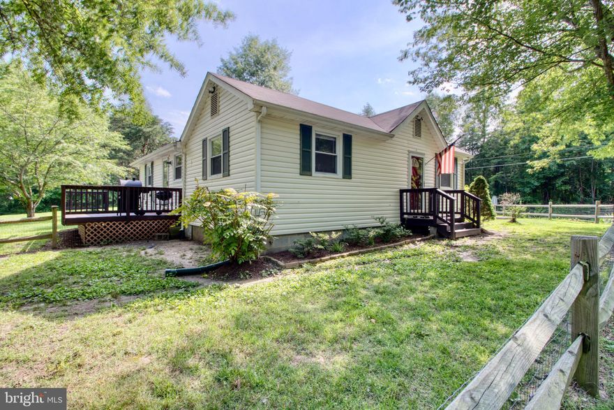 Welcome home to this 2 acre corner lot with tons of room to expand! Freshly painted home features two bedrooms and one full bathroom. The large, country kitchen features stainless steel appliances and opens to the deck. The spacious formal dining room boasts hardwood floors. The large living room includes big windows to bring in tons of natural light! Full bathroom features ceramic tile flooring, large linen closet, and a tub/shower combo. Just 4 miles to I-95 on one road!