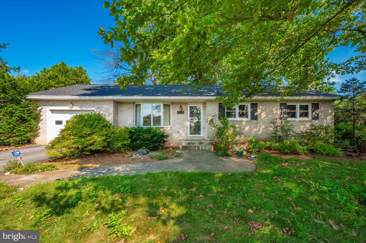 This lovely 4-Bedroom Brick Rancher offers classic character featuring gleaming hardwood floors throughout, a newer roof, and a newer hot water heater. This home is built to last. Set on a spacious lot, you'll love the abundant landscaping with lush plants and greenery in both the front and back yards — ideal for gardening enthusiasts or anyone who enjoys a peaceful outdoor setting. Step out onto the large deck and enjoy the privacy of your own backyard retreat. Located outside city limits, this home comes with the added bonus of NO CITY TAXES and NO HOA — giving you more freedom and fewer expenses! This home checks all the boxes — comfort, convenience, and charm with no extra fees. Come see it today before it's gone!