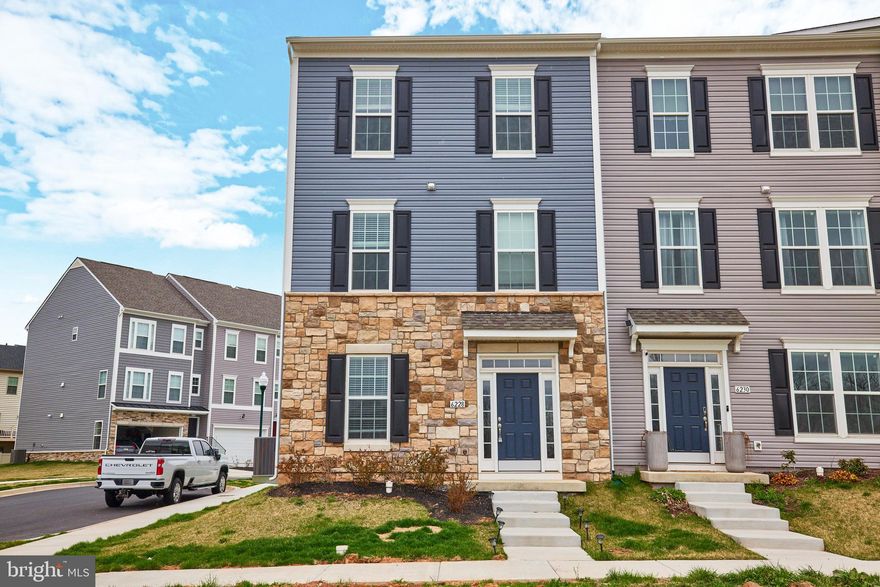 Stunning, like brand new, end unit town home with designer finishes through out the home! Spacious 4 bedroom, 3.5 bath home with a main level bedroom/den/office plus a full bath! Gourmet Kitchen features quartz countertops, stainless appliances, large island, trendy herringbone marble tile backsplash, white cabinetry, pantry and more! Deck access also on this level; Windows galore to let the light and views in! Open concept living and dining room with plenty of space to spread out! Chic light and fan fixtures, recessed lights through out the home. Luxury vinyl plank on the first and second floors; the second  floor also offers a powder room; The upper level has 3 spacious bedrooms and 2 full baths plus a conveniently located laundry - brand new washer and dryer! The primary bath is fully updated with quartz counters and updated light fixtures and dual vanities; Large 2 car rear loaded garage with room on the driveway to park additional vehicles; community also offers plenty of free parking;  Community amenities include a fitness center, outdoor pool, tennis court, basketball court and tot lot - all of this is included in the rent!  Commuter friendly location - quick hop to Rt 15 and I-70; Downtown Frederick is only a quick 10 minute drive as is Fort Detrick. Enjoy the convenience of numerous shops, restaurants and more! Good credit is required; no more than 2 incomes to qualify; Home has been well maintained.  AVAILABLE FOR OCCUPANCY STARTING JAN 15TH! Come see this lovely home today!