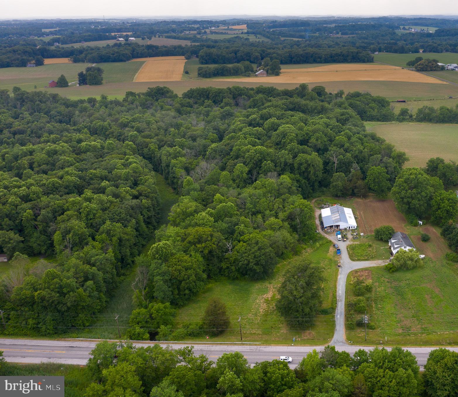 Seller will assist with buyer closing costs towards a rate buy down. Location, location, location! This property is less than an hour from Baltimore and Philadelphia, under 10 miles to Fair Hill State Natural Resource Area, and minutes from the Pennsylvania line. Opportunity galore with this farm of over 17 acres in Rising Sun! The land currently has a small orchard and used as a CSA but has possibilities of horse boarding, subdividing, farming, and/or tree harvesting. Approximately 12 acres is wooded and there is stream on the south side and west side of the property. The 17 acres includes 700 ft of road frontage along Rt. 272 for incredible signage and road side produce sales. The main house features 4 bedrooms, 2 bathrooms, and a full unfinished basement. The property has not been put in agricultural conservation so there are many possibilities for the use of the property. Sold As Is.