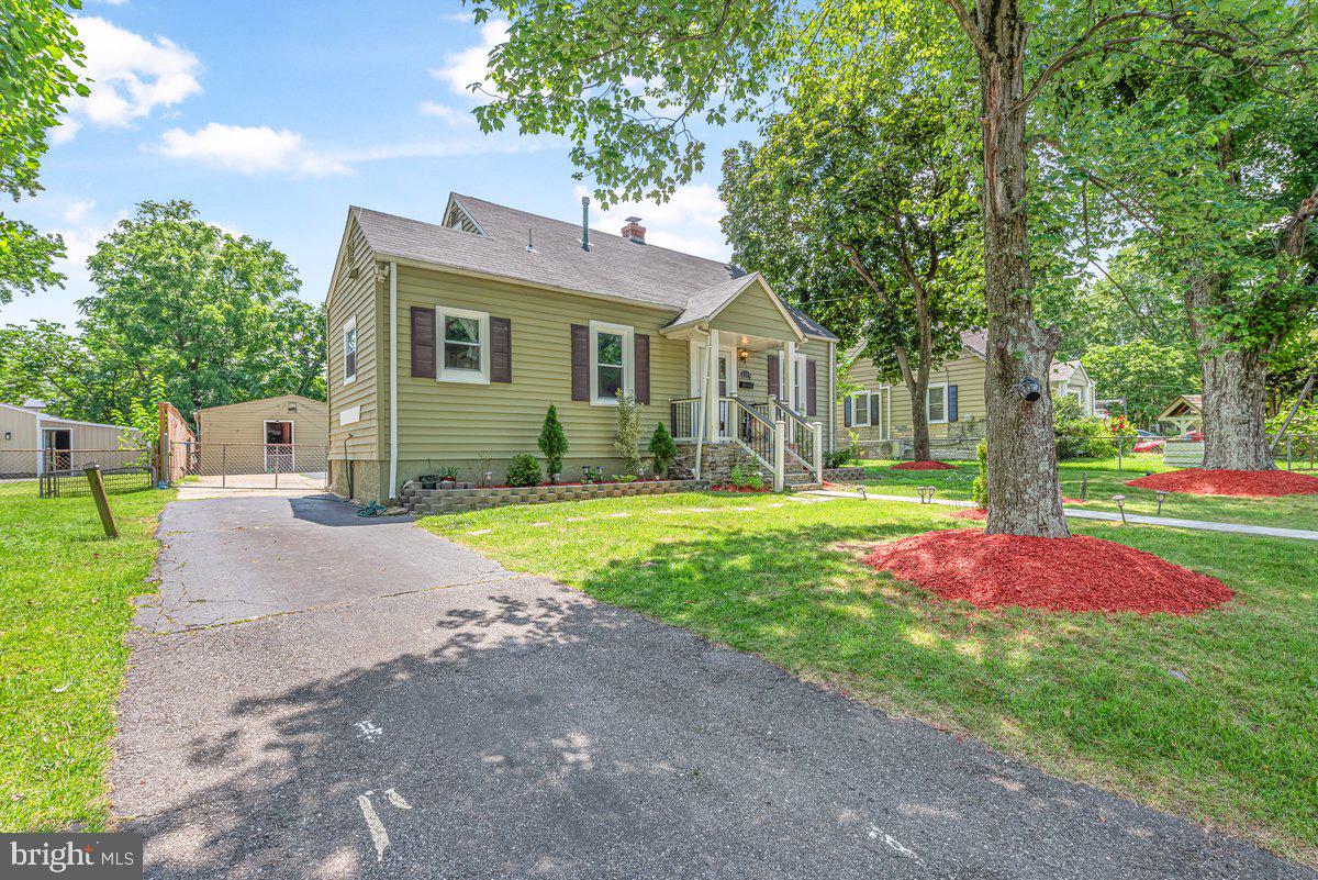 Welcome to this charming and updated 4-bedroom, 2-bath home! Enjoy hardwood flooring throughout, including all bedrooms, along with recessed lighting and multiple outdoor access points on the main level. The updated kitchen features stainless steel appliances, a gas cooktop, granite countertops, extra counter space, and plenty of natural light. Step outside to a large, multi-functional, fully fenced in backyard. The front driveway extends into the backyard, offering multi-car parking and access to multiple storage sheds. Conveniently located near public transportation, restaurants, shopping, public parks, and more—this home offers both comfort and accessibility.