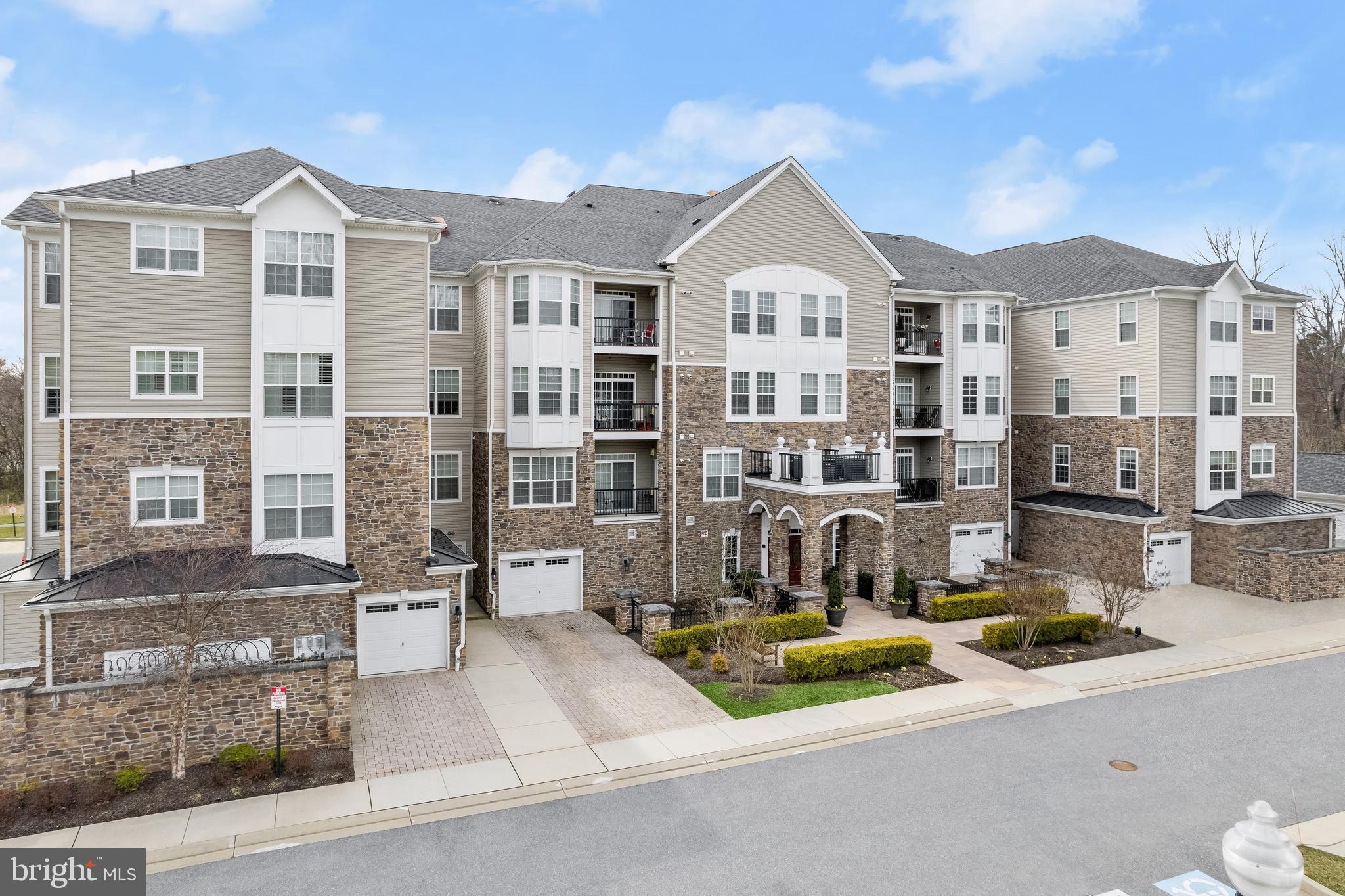 Introducing this top-floor penthouse condo featuring two bedrooms, two bathrooms, and a versatile den in the sought-after Gatherings at Quarry Place, an active adult community known for its peaceful surroundings and modern amenities. Step inside to an open layout filled with natural light, hardwood floors, and a freshly painted neutral palette. The kitchen is well-appointed with granite countertops, stainless steel appliances, and 42" cabinets, while crown molding adds an elegant touch to the dining and living rooms. Sliding glass doors lead to a private balcony, perfect for relaxing outdoors. The spacious primary suite offers a sitting area, walk-in closet, secondary closet, and an ensuite bathroom with a dual sink vanity and walk-in shower with sliding glass doors. The second bedroom and full bath with a tub shower are thoughtfully positioned on the opposite side of the unit for privacy. A den off the foyer provides flexible space for an office, library, or guest area. A dedicated laundry room, ample parking, and a detached garage with additional storage complete the package. Enjoy the award winning community amenities including a clubhouse with fitness center, outdoor pool, garden, dog park, walking paths, social events and so much more! Centrally located right off I-795 and close to everything you need.