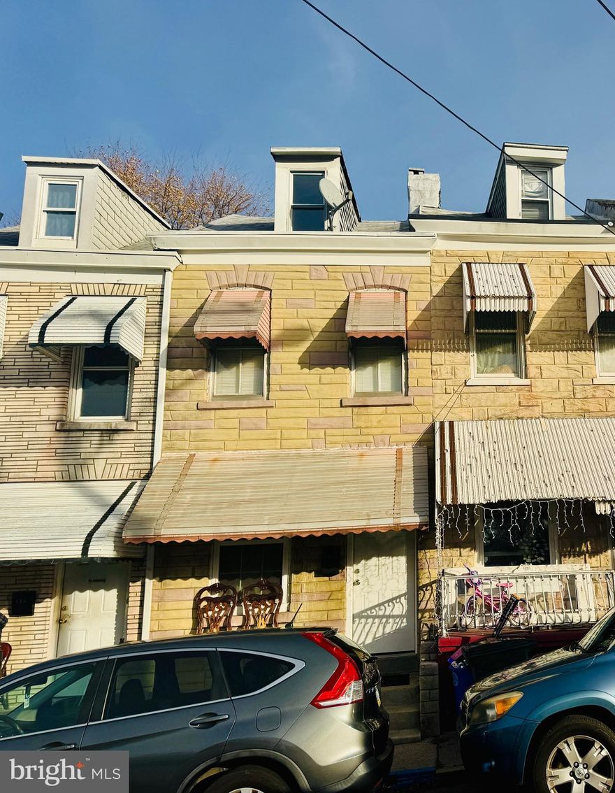 Very small and cozy 2-3 BR middle row in East Reading in need of a lot of work throughout and is being sold absolutely AS IS! This is an estate sale with a holdover uncooperative tenant. The home is all electric baseboard heat. A new gas line has been run into the house. There is off street parking for 1 car.