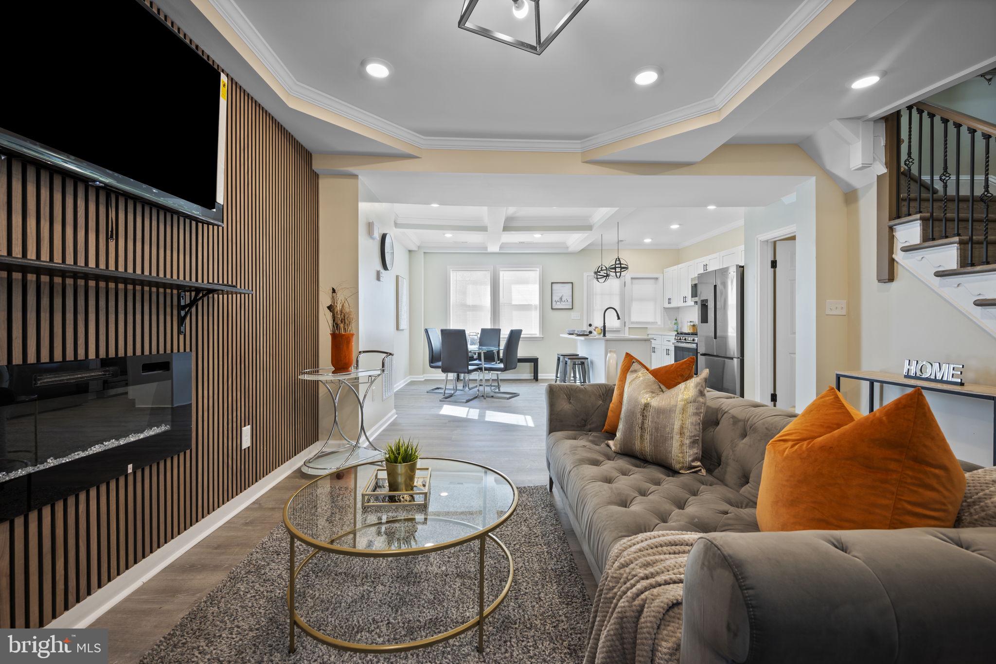 Beautifully remodeled 3BR/2BA end of row brick Townhome located on a quiet street in Park Circle. Make your way through the gated front yard and step up to the covered front porch of your new home. Step inside a home filled with natural light, an open main floor plan, recessed lighting, luxury flooring, crown moldings, and a soft color palette. The main living space offers a spacious living room with a tray ceiling and a custom feature wall, a spacious dining area with coffered ceilings, and a beautiful new kitchen. The kitchen features plenty of cabinets, stainless steel appliances, quartz countertops with a complimenting tiled backsplash, and a stainless steel sink set into an island with pendant lights and breakfast seating. On the second floor are two sizable secondary bedrooms, a larger primary bedroom, and a newly remodeled full bath. The lower level is finished offering additional living space featuring a full bath with a beautifully tiled walk-in shower, a spacious family room, laundry, storage, and a walk-out to the fenced yard. From the kitchen step out into an enclosed sun patio with access to the gated extra wide yard offering a large patio, green space and plenty of possibilities. This home is move-in ready with so much to offer new homeowners and is conveniently located in close proximity to shopping, restaurants, and commuter routes.