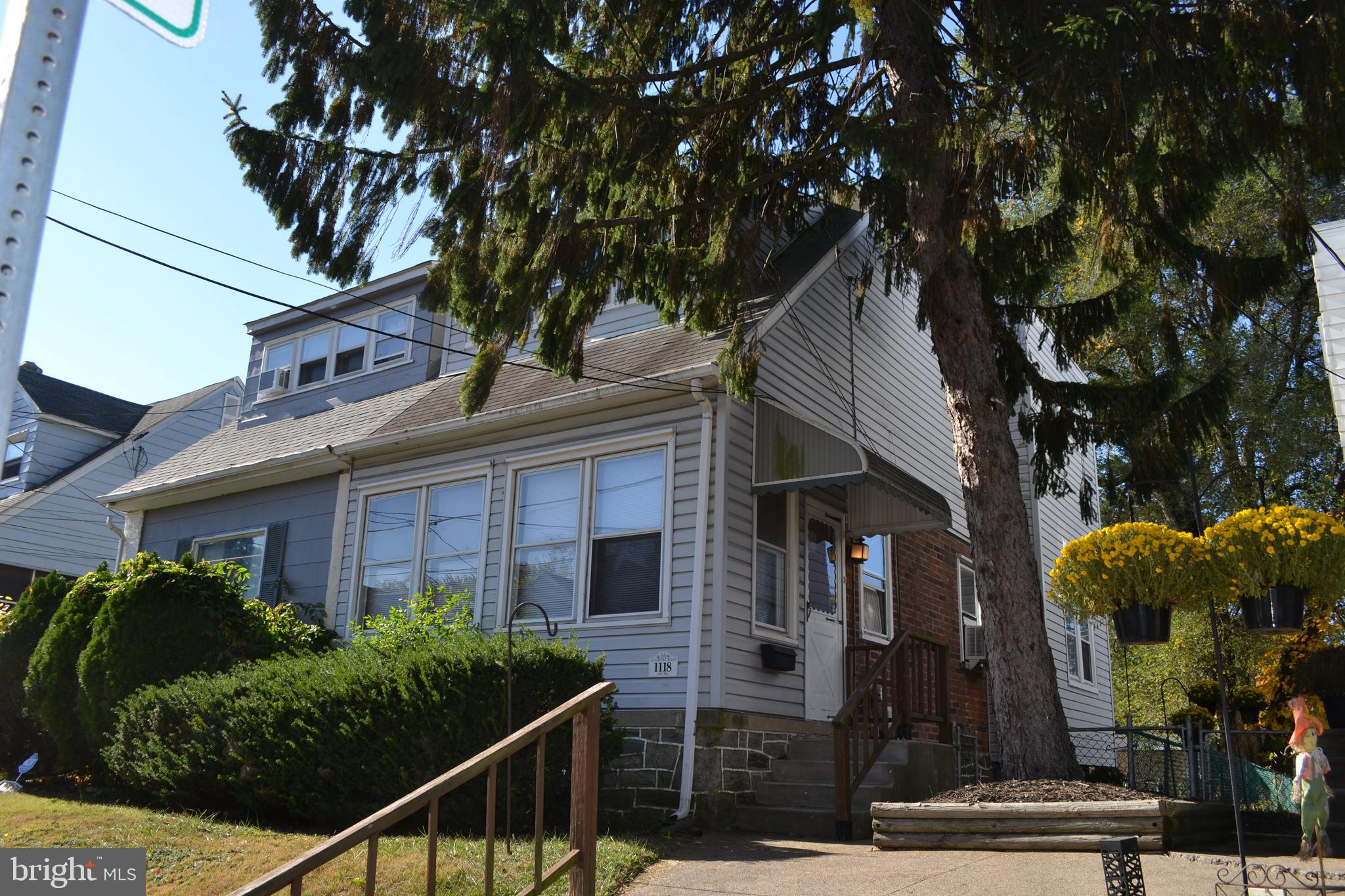 Well Maintained Three Bedroom Twin with Charm and Character in Llannarch Hills and Upper Darby School District. First Floor features Enclosed Front Porch, Spacious Living Room with Corner Fireplace and Formal Dining Room with High Ceilings, Crown Molding and Hardwood Floors, Modern Kitchen with Gas Stove and Dishwasher and Outside Exit to Rear Deck. Second Floor has Large Main Bedroom with Ample Closet Space, Two Additional Bedrooms, Hallway Bathroom with Nice Refinished Bathroom. Lower Level has Many Possibilities for Storage with Laundry Area and Utility Area plus Outside Exit to Rear Yard. The Enclosed Front Porch has the Charm of the Older Homes and is ideal for your Plants, Relaxing, and Reading your Favorite Books. The Rear Cover Deck offers the Perfect Place for Barbecues, Entertaining and Family Gatherings. There is a Rear Alley and Driveway for Off Street Parking. Great Location near the Hillcrest Elementary School, Township Line Road and Route 1, Public Transportation, and Quarry Center with Giant, Lowes, Panera Bread, and Chipotle. This Fine Home has a Brand New UCI Gas Boiler Providing Very Efficient and Comfortable Heat. There is a One Year Home Warranty to the Buyer and Settlement. The Refrigerator and Washer and Dryer are included in AS IS condition. This Great Home is MOVE IN READY ! Inspect and Make a Serious Offer !