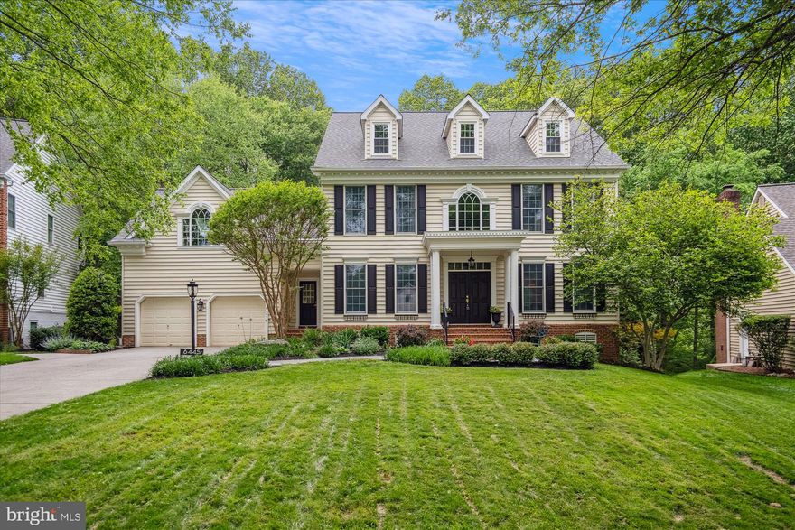 <b> OFFER DEADLINE - SUNDAY, MAY 18TH at 1:00 PM.</b><br><br>

Experience luxury living at its finest in this exquisite Colonial, perfectly positioned on a breathtaking 0.42-acre lot with wooded views in the highly desirable River Hill neighborhood. Backing to the serene Patuxent Wildlife Preserve, this home invites you to enjoy peaceful outdoor living on a screened-in porch that boasts a gas stone fireplace, TV mount, tongue-and-groove wood ceiling, and skylights. Crafted with exceptional attention to detail, this home showcases custom features and premium upgrades throughout. A charming front stone walkway leads to the welcoming covered brick porch, framed by stately columns. Step through double doors into a dramatic two-story foyer, where a hardwood staircase with a custom Craftsman railing and wrought iron balusters sets the tone for the elegant interior. The heart of the home—the gourmet kitchen—delights with top-tier stainless steel appliances, including a commercial-grade six-burner gas range, oversized refrigerator, and built-in microwave and additional wall oven. Granite countertops and dual breakfast bars, a center island, and a designer tile backsplash highlight the kitchen’s superior design. Step into the family room, which exudes warmth with a wood burning fireplace and three sets of French doors, each topped with transom windows, leading to the screened-in porch and expansive IPE Brazilian hardwood deck. The deck is a standout, featuring cable railings, custom millwork, a built-in grilling station with cabinetry, and steps to the private backyard. This level also includes a dedicated office with wall mounted desk and a dual entry mudroom. Upstairs, retreat to a luxurious primary suite featuring a spa-inspired bath with a walnut double vanity topped with marble, a freestanding soaking tub, and a walk-in shower adorned with floor-to-ceiling custom tile, multiple shower heads, and massage jets. Additional comforts include a heated ceramic tile floor with programmable radiant heat and a wall-mounted towel warmer. The upper level hall bath offers a modern floating vanity with dual sinks and tub / shower with glass doors, and floor-to-ceiling upgraded porcelain tilework. Three spacious secondary bedrooms with hardwood flooring—one with a Cove ceiling, skylights, and a custom built-in bookcase wall—provide comfortable accommodations for family and guests. The light-filled lower level is ideal for entertaining, featuring a rec room with full-size windows, a wet bar with beverage cooler and built-in microwave, a potential fifth bedroom next to the third full bath with walk-in shower and quartz vanity, and a dedicated home gym with specialty rubber gym flooring.  Walk-out French doors lead to the lower level patio and spacious garden shed with large windows and electric service. Meticulously maintained, this home also features dual-zoned HVAC, a new roof with 50-year architectural shingles (2025), three new skylights (2025), dual staircases, dual front entries, and upgraded crown molding throughout. Don’t miss your chance to own this extraordinary residence that combines timeless design with modern comforts in a truly idyllic setting.
