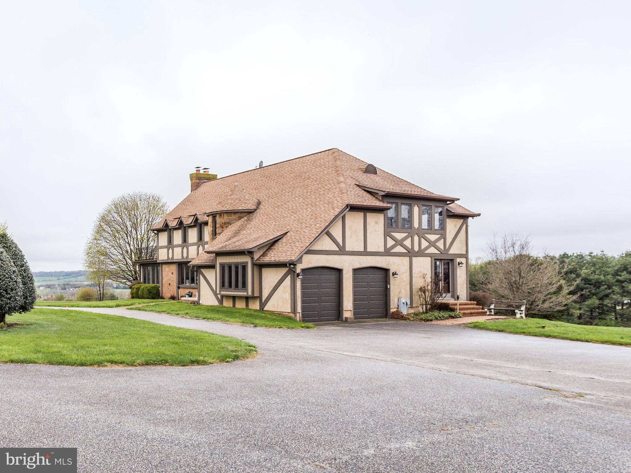 65+ acres of peace and serenity! What a View! House offers large rooms, 3.5 baths, attached sun room, 1st flr family room & Lower level rec room. Designer baths. MBR has atrium doors its own deck. Rear deck is 12x36. 2 car garage & parking pad. Barn is 57 x 130; 10 horse stalls & open area. Stream & Fruit trees too. Home warranty. 24 hour notice required to see. see agent remarks.