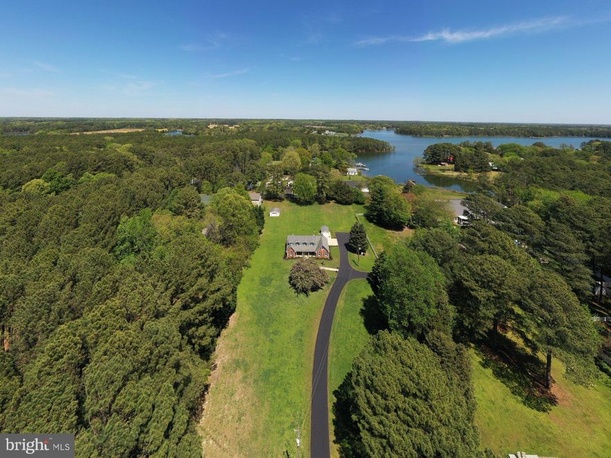 Gorgeous, meticulously maintained brick cape cod on almost an acre and a half with a rear waterview of St. George Creek!  Come home to scenic Piney Point sunsets and enjoy the water lifestyle with nearby St. Georges Island and public boat ramp which provides access to surrounding waterways!  This home is nestled on over an acre. Beautiful, professional landscaping, freshly seal coated driveway with plenty of parking, large shed and concrete pad for more outbuildings. This home features a large, cozy living room with a full wall brick fireplace and gas insert, a beautiful remodeled kitchen with solid wood mahogany cabinets and built ins, granite countertops and newer black appliances. Large main level bedrooms with remodeled bathroom and two bedrooms upstairs as well with charming angled ceilings. Large laundry room and plenty of storage, beautiful front porch to gaze out at the peaceful view while enjoying your morning coffee. Book your showing of this lovely home today!