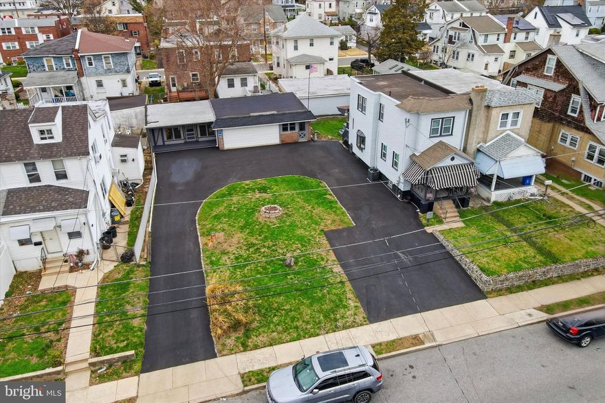 Your dream property in Collingdale Borough just hit the market! The sale includes 2 parcels, one of which is a double wide lot, creating a unique expansive property for the area at 75'x100'! Not only do you get a home that has been lovingly-maintained and updated, but also a detached garage, studio for versatile use, shed storage area, and semi-circular driveway for lots of parking. Home updates include remodeling throughout, including both bathrooms and, most recently in 2025, the basement and kitchen renovation, plus new roof in 2022 and new HVAC in 23/24. The main level includes living room with ceiling fan, separate dining room with tray ceiling, and updated kitchen with white shaker cabinetry, black quartz counters, and tiled backsplash. Upstairs, there are 3 carpeted bedrooms and updated hall bath with walk-in shower and storage shelving. The walkout basement is finished for additional usable space and includes a second full bathroom with stall shower. Outside, there's just as much to see as inside! There's a front porch, a rear covered deck, and small yard area with hot tub. There's also a studio with adjacent shed storage space - the studio could be used as an office space, home gym, entertaining space, you choose! An oversized 2-car garage provides covered parking plus extra space for storage or work areas. Both the studio and garage have electric. Don't forget the driveway with 2 curb cuts for ease of access and parking for 8+ cars, plenty for you and your guests! This unique property is not to be missed! Schedule a showing today!