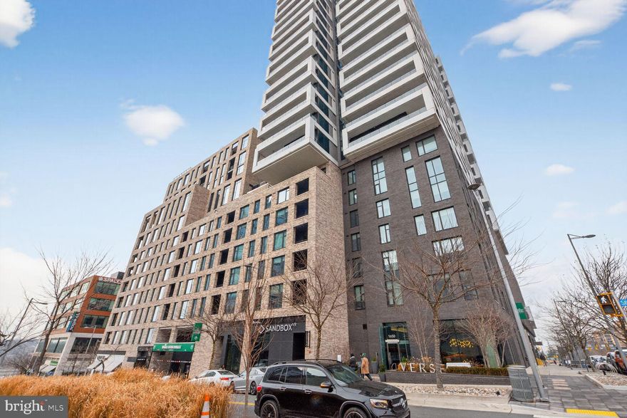 Spacious One Bedroom + Den in the Verse Luxury Condominium in Tysons.  An open concept living space features oversized windows, 10’ ceilings, modern finishes and hardwood floors. A gourmet Kitchen with Italian cabinetry, Bosch appliances and waterfall center island adjoins the Living Room with views of the SkyPark deck. The main Bedroom suite offers a large walk-in closet and oversized bathroom with marble floors, soaking tub and washer/dryer. The bonus Den or home office is set off the foyer and is complimented by a Powder Room. The sophisticated Verse condominium offers a 24/7 concierge, well equipped fitness facilities, luxurious lounges and the SkyPark terrace with pool and an outdoor entertaining area. This home offers a great value to enjoy quiet luxury at home while being walkable to Tyson's great restaurants, entertainment or the Silver Line Metro to enjoy the best of Washington, DC. Secure Garage Parking conveys. Schedule your tour today!