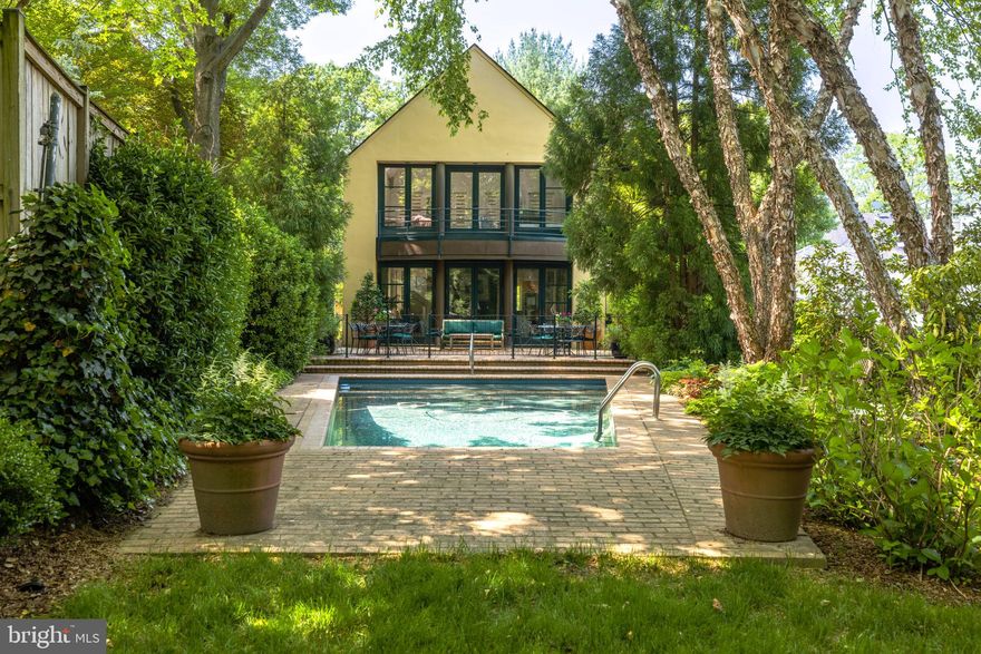 Show-stopping backyard! Originally built in 1940, this architect driven colonial transformation includes over 4,000 sq feet of light filled gracious living space.  Floor plan offers 4 bedrooms, 4.5 bathrooms, dedicated office, loft space, lower-level rec room and two car garage with extra storage areas.  Two wood burning fireplaces located in the dining and living room, three sets of French doors that open onto the brick patio overlooking the heated pool, perfect for entertaining and enjoying the park-like setting.  Views are unencumbered to the vast lush green lawn surrounded by mature professionally landscaped gardens and beautiful river birch trees.  Skylights at every turn, gourmet kitchen and updated baths by the timeless BarnesVanze Architects, custom built-ins throughout and plentiful closet space.  Tesla solar panels will convey, which have earned more than $20K of SREC credits since installation and help maintain a low monthly Pepco bill.  A one-of-a-kind beloved home within walking distance to Georgetown Hospital and steps away from Palisades shops & restaurants! 
Open house Sunday 6/4 from 2-4pm.