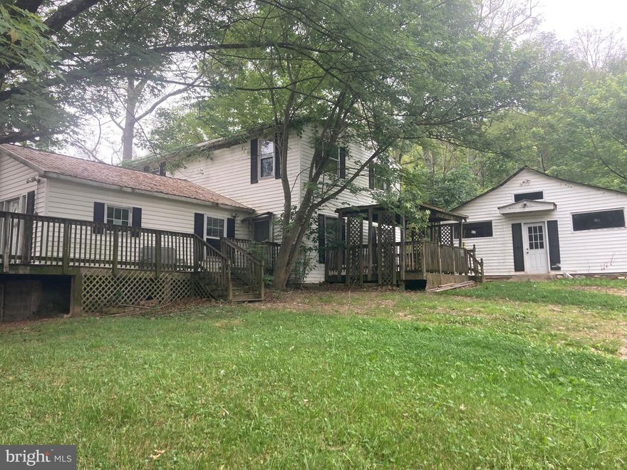 JUST REDUCED! CALLING ALL INVESTORS! Large affordable home conveniently located near Paw Paw and Slanesville. About 45 minutes to Winchester. Bring your tools and creative skills and turn this into a beautiful home. ( House needs complete renovation inside ) 7-8 Bedrooms ( 8th one has no closet )Cash or conventional financing  only.  DO NOT GO ON DECK FRONTING HIGHWAY. Additional .4 acre parcel included. County states plat maps are most likely inaccurate.