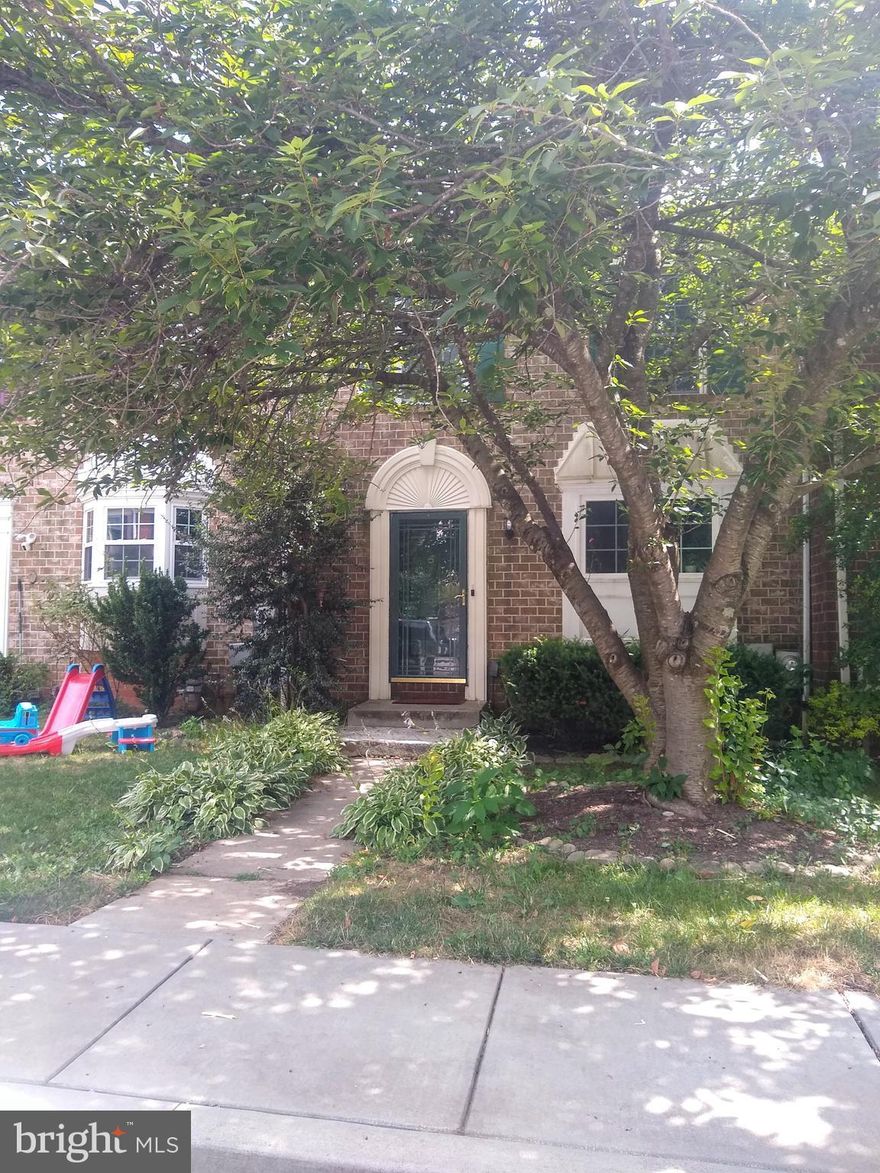BRIGHT kitchen with breakfast bar which opens to liv/din room with hardwood doors and sliding doors to rear deck, Lower level is finished with family room featuring wood burning fireplace and sliders to rear paver patio  with storage. Young roof with  new windows and gutter helmets.