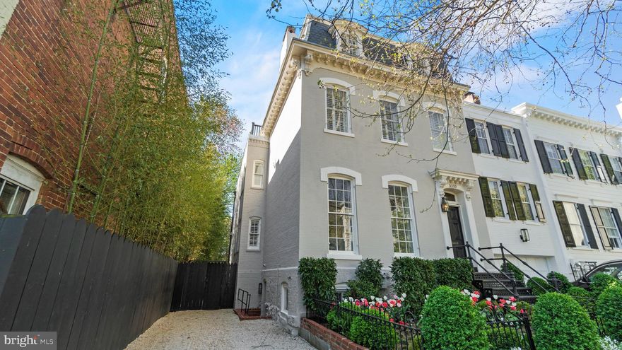 Welcome to 3310 P Street NW | An exceptional residence ideally positioned on a serene one-way street in Georgetown's coveted West Village with a 2 car driveway. This distinguished 5-bedroom, 5.5-bathroom Federal home, beautifully renovated by Cecchi Homes, seamlessly blends historic charm with contemporary luxury. Entering through the inviting, gated front garden, you are greeted by the grandeur of the main level, where soaring ceilings and meticulously restored period details creates an ambiance of timeless elegance. The living room, illuminated by expansive front-facing windows, flows seamlessly into the formal dining room, offering an ideal space for gracious entertaining. The beautifully updated Kitchen features top-of-the-line appliances, marble countertops, and a spacious center island. The connecting family room with fireplace bathes in natural light from the rear-facing windows overlooking the pool and surrounding garden. With direct access to the rear outdoor area, this space provides a sanctuary for seamless indoor, outdoor living. The pool and tiered terrace are made private by the surrounding foliage. The primary suite is complete with a luxurious en-suite bathroom,  two walk-in closets and a sitting area. There are 3 additional well appointed bedrooms and two full baths. A  roof deck provides a picturesque setting for al fresco gatherings against the backdrop of Georgetown's iconic skyline. The lower level features a  sitting room, pool full bath, laundry room and 5th bedroom with a 2nd Full bath.