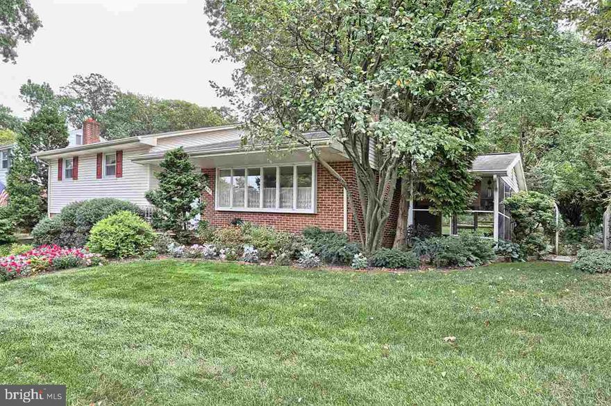 this lovingly landscaped home is ready for new owners! Imagine living in the light filled LR w/fireplace which leads to a private three season side porch. Other amenities, DR, eat-in kitchen w/corian counters, sink, tile floor, 3 bdrms, 2 full baths, great closet and storage space. Flexible 1st fl. rooms (2) could be office/bdrm. w/adjoining FR or play room. Replacement windows, ceiling fans, solor tubes installed. All appliances remain. Home Warranty included.