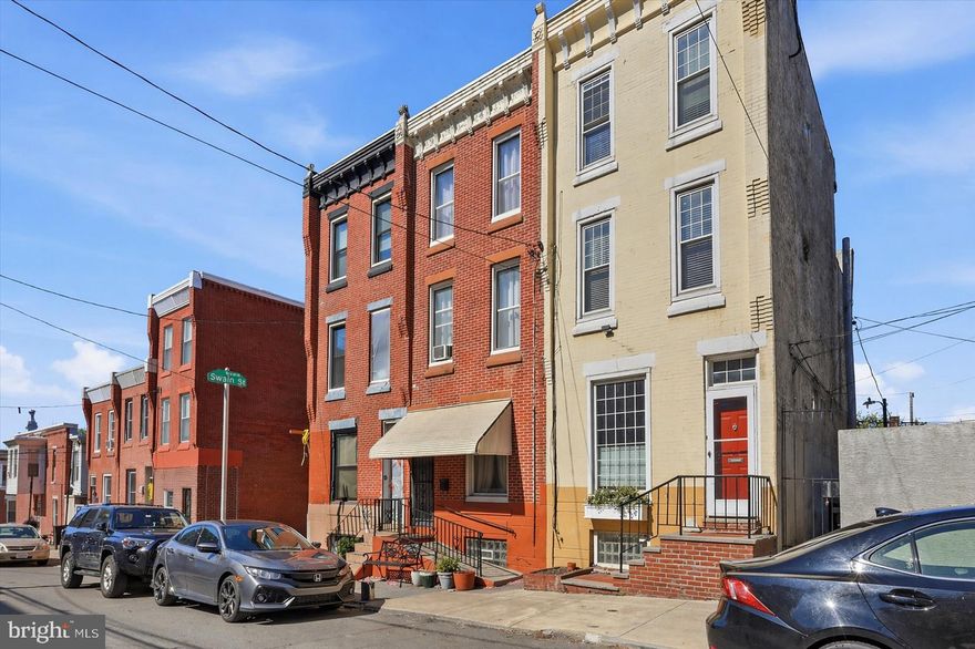 Perfectly positioned in one of the city’s most beloved neighborhoods, 790 North 27th Street offers the kind of location that makes daily life feel effortless and the kind of home that makes coming back feel even better. From here, you’re just moments from the iconic Philadelphia Museum of Art, scenic runs and bike rides along Kelly Drive, and evenings spent strolling past the lights of Boathouse Row. Groceries, coffee, and everyday essentials are simple with Whole Foods Market just minutes away, making it easy to grab ingredients on the way home and settle into the rhythm of the neighborhood.
That rhythm continues the moment you step inside. The first floor features an open, inviting layout that seamlessly connects the living, dining, and kitchen spaces, ideal for gathering, hosting, or simply enjoying a relaxed night in. Just off the kitchen, a private outdoor area creates a natural extension of the living space, perfectly suited for grilling, dining al fresco, or unwinding at the end of the day. It’s the kind of setup that makes summer evenings feel easy and spontaneous, and weekend entertaining feel second nature.
The finished basement adds valuable flexibility, whether used as a home office, fitness area, media room, or additional living space, an increasingly important feature for modern city living. Upstairs, the second floor offers two well-sized bedrooms and an updated full bathroom, providing comfort and convenience for family or guests, enhanced by a skylight that bathes the space in natural light.
The third floor is dedicated to a charming and private primary suite, lined with exposed brick and custom wood built-ins, complete with its own full bathroom and deep closet, creating a peaceful retreat that feels tucked away from the rest of the home. Just beyond the suite, sliding doors provide access and present a compelling opportunity to create an idyllic roof deck, an easy future enhancement that could deliver sweeping 360-degree views of the skyline, sunsets, and even seasonal fireworks. Adding to the everyday practicality of this level, an additional room located just off the finished bathroom conveniently houses the washer and dryer along with valuable storage space, keeping daily routines organized and efficient.
Fairmount is known for its tree-lined streets, vibrant local scene, and true neighborhood feel, all while offering quick and convenient access to Center City and suburban destinations alike. 790 North 27th Street brings all of that together, location, livability, and a home designed for the way people actually live today.