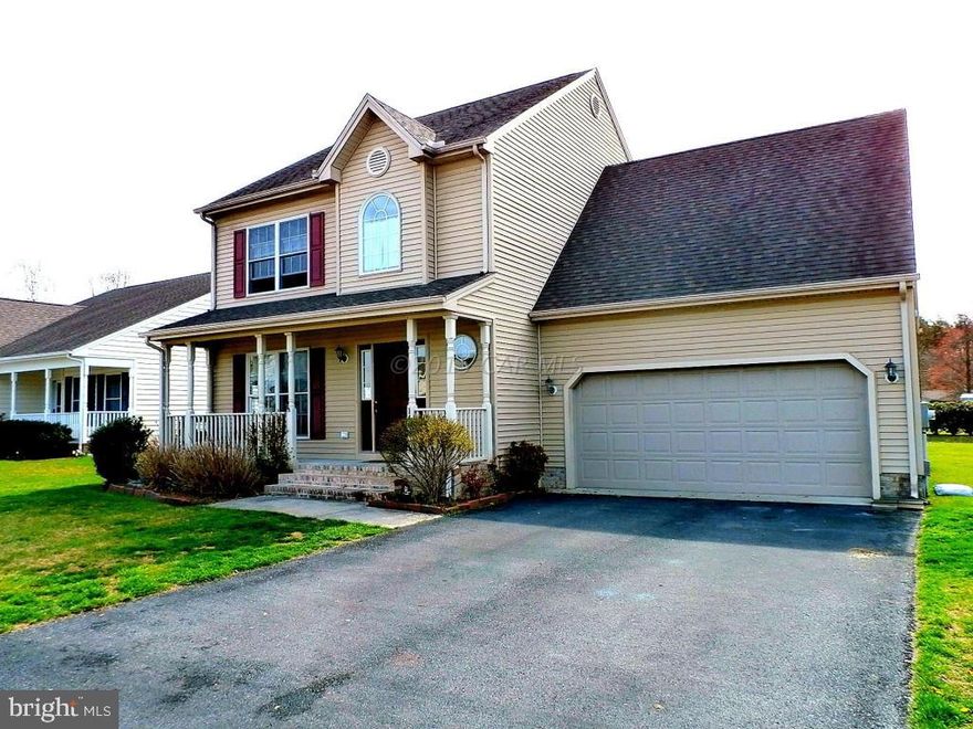 Bright, open and airy best describe this home. Rich hardwoods greet you upon entering the foyer as well as the formal dining room. Sliding glass doors take you from the kitchen to the rear deck, which is great for entertaining! There's a half bath just off the hall between the living room and kitchen. Three large bedrooms upstairs with a full master suite complete with a walk-in closet. For your convenience, the laundry room is also located on the second floor-no more lugging clothes downstairs. The large 2 car garage has plenty of room for your vehicle and yard equipment. A 4 inch well supplies the in-ground irrigation for the mature landscaping. All of this for a new lower price and now offering a FREE 1 YEAR HOME WARRANTY!