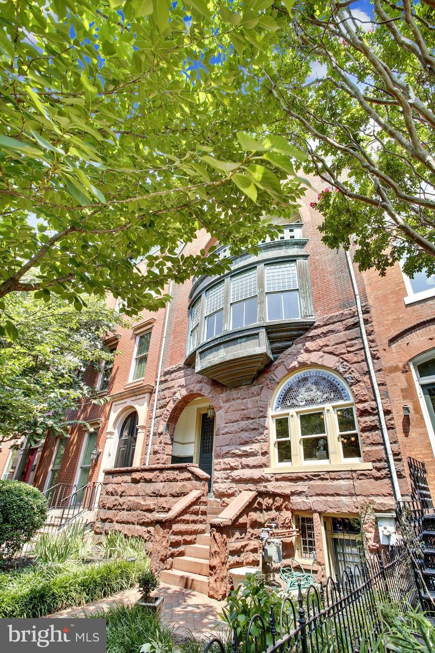 Own a piece of history!  Grand Dame on Capitol Hill's most prestigious street. The Doolittle-Tullock House is a stunning Richardsonian Victorian designed by architect Robert Stead (1887) with stained glass windows, 11 ft ceilings ,a second story corbeled bay, and a third story balcony with a view of the Capitol! It also features a fourth floor garret/artist studio, as it was once owned by the family of Lincoln Memorial sculptor Daniel Chester French. This magnificent house features 9 fireplaces, 5 bedrooms, 4 1/2 baths, dining room, library and 2 parlors. This rarely available historic stunner on East Capitol Street is featured in The Majesty of Capitol Hill (2005, pp104-109) boasting 5250 SF plus 1300SF basement (with 8 ft ceilings) and parking for 3 cars!