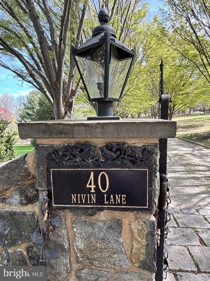 Sitting high atop a hill amidst the rolling landscape of Chester County, this stunning executive retreat boasts gorgeous vistas from every angle!  This lovely English Country Manor home offers approximately 9700 sq. ft., 3-floor stately built home located on a private 2.4 2.4-acre lot, (30 minutes outside Wilmington, DE, and 45 minutes outside Philadelphia, PA).  The property is a 5 bedroom, 8-bathroom, 4-car garage, 4-fireplace, primarily stone structure with significant amenities backing to a large nature preserve.  The property was built in 2002 for $2.7 million ($2.2mm home construction, $500k lot) and over $2 million in landscaping and additional upgrades since its original construction, with a gated driveway made of pavers and lined with gorgeous mature trees. Large flagstone, baluster-lined deck with entrance from kitchen and family room. This home boasts gorgeous woodwork/millwork throughout the entire property and on every level. The main floor includes a chef's dream of a kitchen with premium appliances, loads of cabinet space, a huge butler's pantry, and a stately Dining Room with plenty of room for large gatherings.  Go up the winding staircase to the 2nd floor, where you will find a luxurious owners' suite w/walk-in closet, full bathroom, and a large sitting room. The other bedrooms are spaciously appointed, including full bathrooms and large closet spaces.  There is also a convenient laundry center.  The lower level includes an entertainment area, Brazilian Cherry Flooring, a Custom-Built bar w/Granite Counters, a commercial ice machine, dishwasher, sink, custom bottle shelving, stone gas fireplace, theater room, enclosed lower deck level w/sliding glass doors, and a mechanical room that controls this amazing home. This home is priced well below the market value for a quick sale due to the overall condition.  If this home had been better maintained over the last several years, the estimated value would be closer to 4.5-5Mil. This home needs TLC and some investment, but what an amazing home and location!!! This home also offers a full home backup generator system. All of the bathrooms, the entire basement, and the garage are heated with radiant heat.