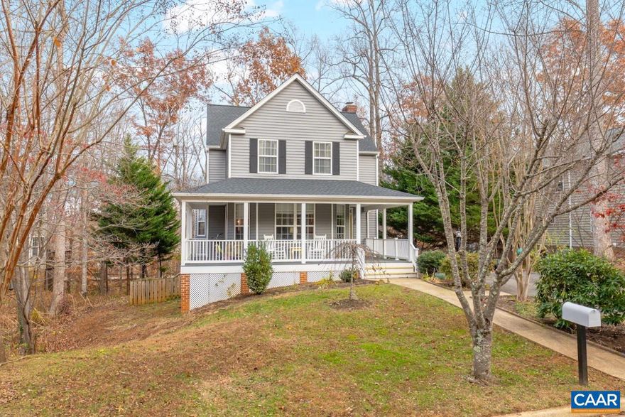 Open house 1/18 from 2-4. Nestled on a quiet cul-de-sac just five minutes from UVA and Downtown Charlottesville, this sun-drenched Redfield?s home perfectly blends timeless charm with modern luxury. A spacious wraparound front porch welcomes you into an elegant interior boasting gleaming hardwood floors, crown molding and a cozy wood-burning fireplace. The renovated gourmet kitchen is a chef?s dream, featuring sleek quartz countertops, a massive farmhouse sink, upscale electric range, and a stylish tile backsplash. Retreat to the primary suite, where a custom-organized walk-in closet offers unparalleled storage. The versatile finished basement, complete with a full bath, serves as an ideal in-law suite or expansive recreation room, while the unfinished area provides ample extra storage. Significant recent upgrades offer peace of mind, including a new roof $12k (2025) and siding $45k (2021). Outdoors, the rear deck and patio overlook a lush, partially fenced backyard that backs to serene mature trees. With a short stroll to the community pool, playground, and scenic trails, this home offers an idyllic lifestyle in an unbeatable location.,Quartz Counter,White Cabinets,Wood Cabinets,Fireplace in Family Room