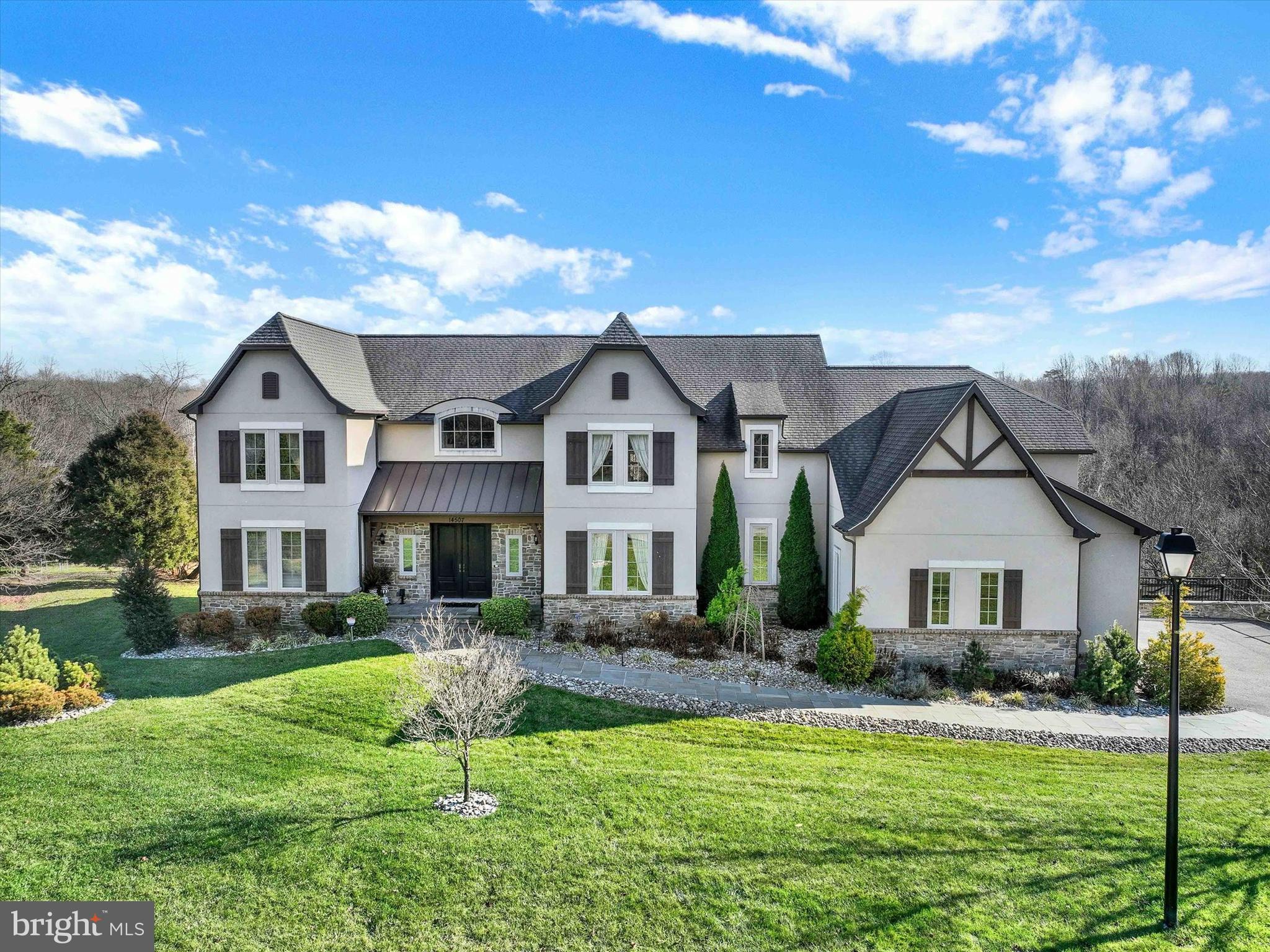 Welcome to this stunning home in the sought-after Ventry Farm community of Sparks, MD. This exquisite property offers a luxurious lifestyle with its impressive features and prime location at the end of a cul-de-sac. As you step inside, you'll find a grand 2-story great room with a decorative stone fireplace that creates a sense of both spaciousness and elegance. The first floor boasts a convenient bedroom with an ensuite, perfect for guests or use as an office. Upstairs, the primary bedroom awaits with its own private balcony. The primary bathroom is fitted with a new 70" free-standing soaking tub, a rain showerhead, and body sprayers for a spa-like experience. The Sonos home sound system adds a touch of modern tech. Step outside to discover the exceptional exterior features, including two Trex decks that afford ample space for outdoor entertaining and relaxation. The bluestone patio features a fireplace, creating a cozy ambiance for gatherings. The new landscaping and landscaping lights enhance the beauty of the outdoor space. The home is equipped with 50 owned solar panels which means zero electricity bill for the owner. Additionally, a Green Designation ensures tax exemption through 2024. The 3-car garage provides abundant space for vehicles and storage. An 80-gallon hot water heater ensures you never run out of hot water. A 50-year roof shingle adds durability and peace of mind. The Basement has au pair or in-law suite potential with 2 bedrooms, a full bathroom, seperate entrance and a wet bar that could be converted to a second kitchen. Only 8 minutes to Wegmans.Just minutes from I83 and close to Hayfields Country Club and Hunt Valley Town Centre and its array of shopping, dining, and entertainment options. Don't miss the opportunity to make this exceptional property your own and experience the perfect blend of luxury, sustainability, and natural beauty.