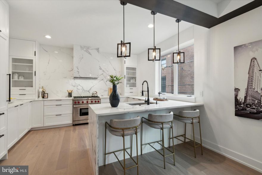 Exceptional Bella Vista home, a rare opportunity for city lovers looking for both style and convenience. Nestled in Bella Vista, one of Philadelphia’s most vibrant and sought-after neighborhoods, this fully renovated residence offers luxurious urban living in the heart of it all.  This home is located in the Meredith Catchment!

The two-car garage is an enviable bonus, offering rare convenience in city living.  As you enter from the garage, you'll love the dedicated storage space for shoes, backpacks, coats, and keys—keeping your home organized and clutter-free.  On this main level, you'll find a versatile living space that adapts to your family's needs, whether it's a cozy home office, a playroom for the kids, or a TV room for family movie nights.

Need space for your workouts? The lower level is ideal for a home gym, giving you a convenient spot to stay active without ever leaving the house. This home is thoughtfully designed to grow with your family!

On the 2nd level you'll find a thoughtfully designed, open-concept space that effortlessly combines modern elegance with classic Philadelphia charm. Whether you're hosting friends or enjoying a quiet evening, the seamless flow between the living, dining, and gourmet kitchen areas makes it easy to do it all. The living area features a gas fireplace, adding a touch of warmth to the upcoming chilly fall evenings. With high-end features like a Wolf oven/range, Sub-Zero refrigerator, custom cabinetry, and quartz countertops, the kitchen is a dream come true for any cooking enthusiast.  

The luxury continues in the spacious master suite, your personal retreat from city life. Unwind in the spa-inspired ensuite, complete with a soaking tub, dual vanities, and sleek fixtures. Three additional bedrooms ensure there's plenty of room for family or guests, each offering the same impeccable attention to detail.

And don't forget about the outdoor living spaces—two private areas perfect for relaxing or entertaining. Head up to the rooftop terrace for breathtaking views of the Philadelphia skyline, an ideal spot to enjoy a morning coffee or evening cocktails.

With easy access to all the best dining, shopping, and cultural experiences the city has to offer, this home is more than just a place to live—it's a lifestyle. Don’t miss your chance to experience the best of urban luxury. 10-YEAR PARTIAL TAX ABATEMENT.