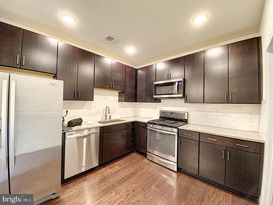 Beautiful 2-Bed, 2-Bath Condo in Prime Vienna Location!
Step into this stunning, light-filled condo just moments from the Vienna/Fairfax Metro Station! Boasting an open floor plan with spacious living and dining areas, this home is perfect for both relaxing and entertaining. The gourmet kitchen impresses with granite countertops, a convenient breakfast bar, rich maple cabinetry, stainless steel appliances, and elegant hardwood flooring.

The primary suite offers a walk-in closet and a luxurious en-suite bath, while the private balcony provides a peaceful retreat with lovely neighborhood views. This secure, fob-access building includes elevator access and comes with two assigned underground garage parking spaces plus additional outdoor guest parking.

Residents enjoy access to the Providence Community Center, featuring a gym, fitness center, game room, and more.

With quick access to Routes 29, I-495, and I-66, this is a commuter’s dream!