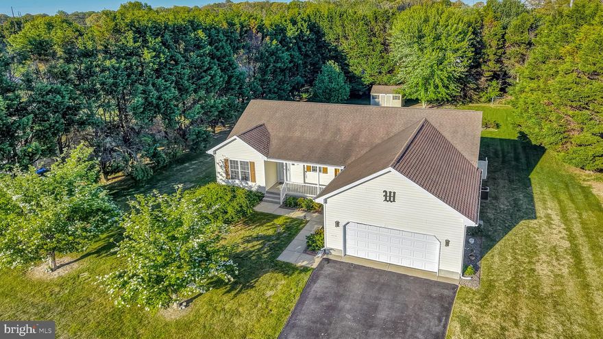 Tour this lovely Milton home today! Just minutes to Lewes & Rehoboth. Perfectly situated on a half acre lot. This spacious home offers the perfect blend of comfort and style. The kitchen features stainless appliances and plenty of counter space. There are three spacious bedrooms and two baths. Step outside to the deck, where a retractable awning provides shade, or enjoy the screened in gazebo, perfect for enjoying beautiful weather and evenings! Energy efficient Heat Pump (Approx 2024).  Make your move!