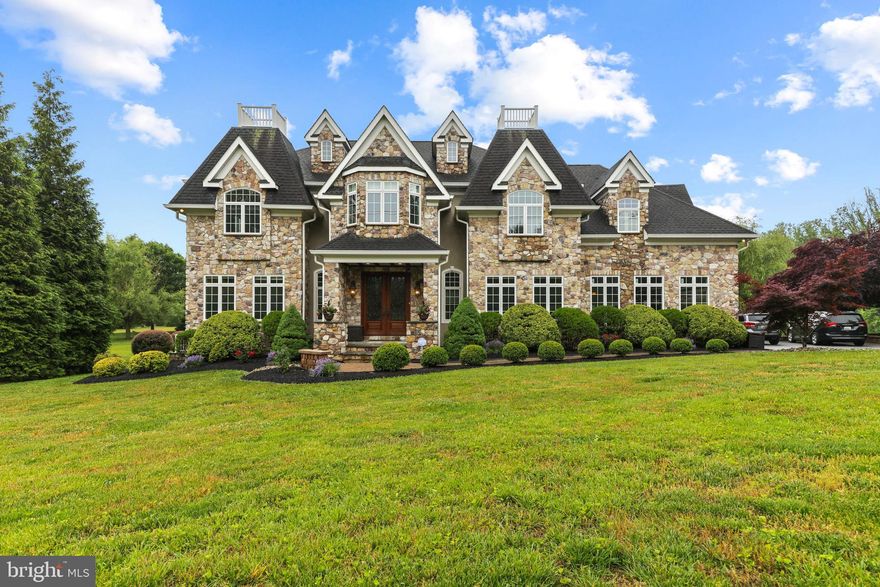 Incredible custom built home on a level 2 acre lot in Lutherville!   Exterior features include beautiful landscaping, a stately all stone front, hip roof with 6 turn gables, fenced in rear grounds with high end composite decking and rails.   The main level boasts a soaring 2 story foyer with double curved staircases.  The open concept kitchen and family room is combined with additional rooms including a study, dining room, and full sized laundry room on the main level. Tons of trim and attention to detail throughout.     The lower level is completely finished with tons of extra living space including a full sized wine cellar and full bathroom.   The upper level has 4 large bedrooms and a brand new full renovation to the owners suite including polished porcelain tile, floating double vanity with glass top & porcelain sinks, a HUGE shower with 2 rainfall shower heads & 3 built in niches,  luxury free standing tub with waterfall filler & chandelier, and a towel heater!    The owners closet has been redone with custom wood shelving.   Other recent upgrades include new guest bathroom, new laundry upstairs,  new samsung washer dryer, new kitchen hardware, washing machine and fridge, new water heater, all new toilets throughout, new sump pump with battery back up, UV air filter system and water softener system.   Hundreds of thousands in recent upgrades!