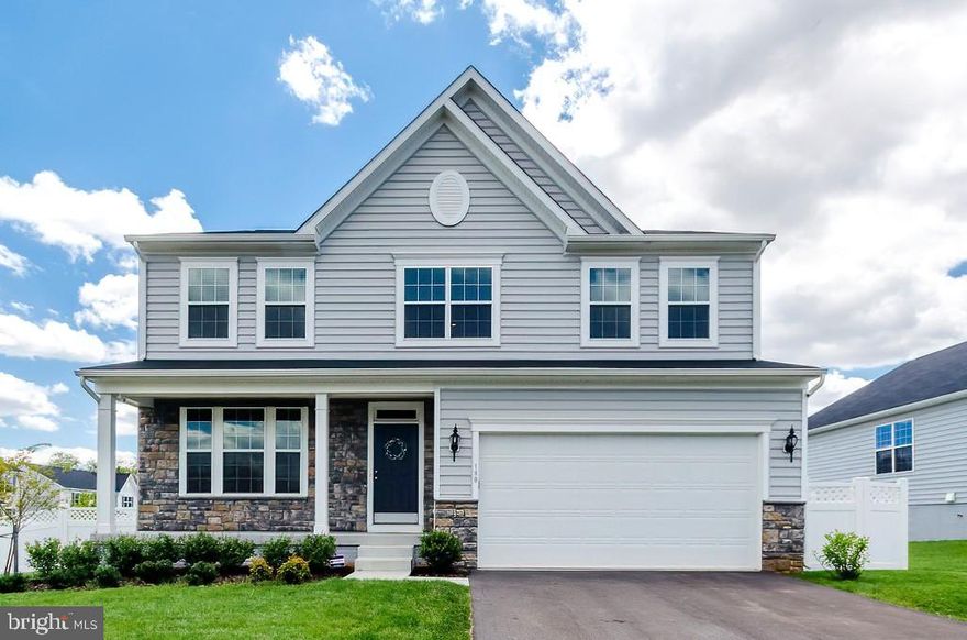 PRICE CORRECTION!!!! FOR THE SUMMER!!! COME AND GET IT WHILE IT'S HOT! Here is a beautiful almost new Lancaster Model home by KHovnanian Builders ready for new occupants.  This model is the largest offered and adds the additional finished basement space offering an added 5th BR and full bath as well as a HUGE recreation room plumbed for a wet bar and an outside access.  The owners added gorgeous porcelain plank  flooring to the main level, an insulated 3 car tandem garage and a full privacy  fenced yard.  Upper level offers 4 full bedrooms AND an open loft. Beautiful lawn on a corner lot at rear of community with paved drive.  Make this one your own and have a move in ready home for summer!