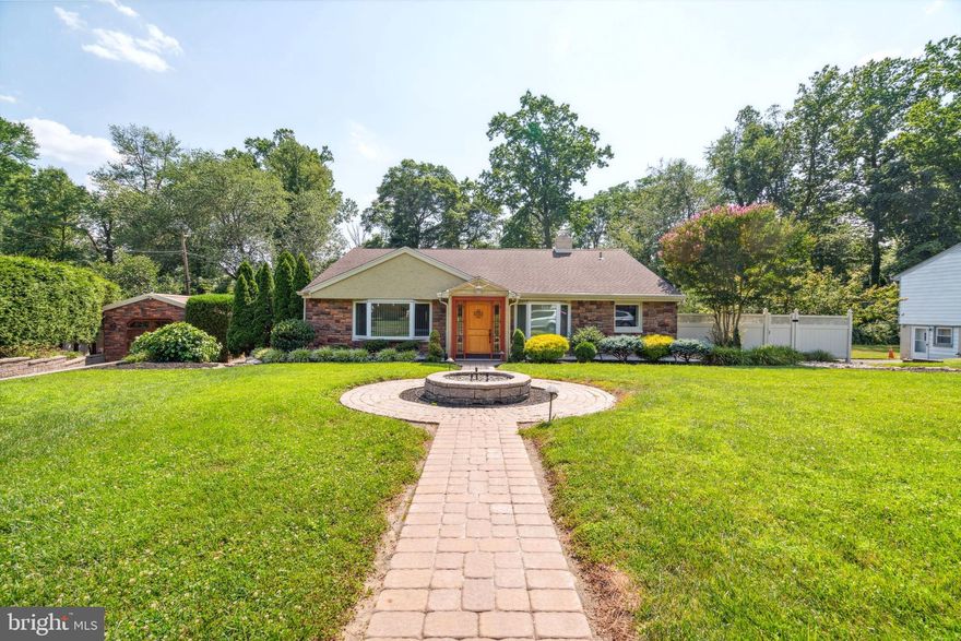 JUST REDUCED 50K, this refined contemporary home with exquisite character and charm is located right in Jenkintown’s most coveted neighborhoods. Enter to experience the elegant living room and formal dining room with 9-foot-high ceilings, romantic archways, vast bay windows with custom curtains, and crown molding and recessed lighting throughout the entire home. Complete with a full bath with a quaint brick wall detail and door leading outside to the back garden. Upstairs, the beautifully finished hardwood floors continue to grace the home as the 2 master suites and spacious bedroom with prominent closet space and 3 updated full bathrooms are explored. The primary master suite has a spectacular spa style full bath with 12 jets bathtub, double headed shower and built in foot spa for full relaxation. The serene ambience continues to the 1st floor as the Florida style bonus room overlooks the magnificent waterfall of the outdoor koi pond. While the gourmet custom kitchen is an absolute chef’s dream with gleaming granite surfaces, custom wooden cabinetry with pantry,  custom backsplash tile, and stainless appliances. This floor is accompanied by a chic bar with white quartz countertop, 2 wine refrigerators, with a wooden wine rack, a cozy sitting area with a marble fireplace, laundry room with white quartz counter and washer and dryer, and an updated full bathroom to complete the amenities. The back of the home has a grand outdoor oasis decorated with stone pavers. Step outside to the back patio to a unique stone fireplace with an outdoor kitchen including a barbeque grill, sink, and mini fridge. Entertain while enjoying the beautiful garden space that wraps around the entire backyard and have guests park in the extensive driveway or in one of the 4 detached garages.  Additional features of the home include an elevator, HVAC system, tankless water heater, backup generator, rear steel fence with outdoor lighting, timed outdoor lighting and sprinkler system. You will fall in love with the extraordinary quality of this enchanting home.