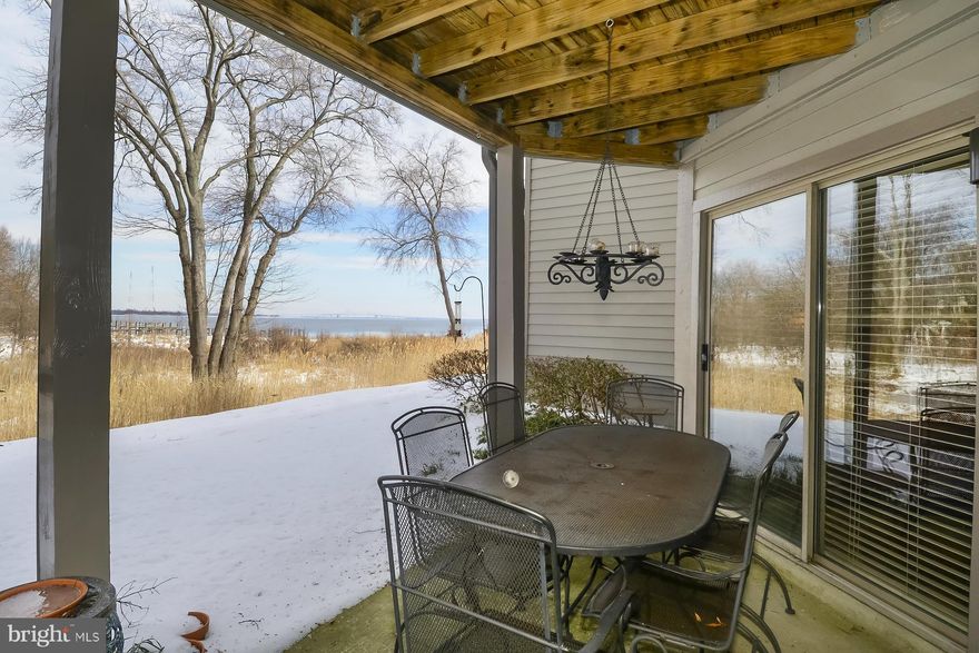 Luxury patio condo in Chesapeake Harbor, water views of Chesapeake Bay Bridge from Living Room and Master Bedroom.  Wide plank hardwood floors, stainless steal appliances, gourmet kitchen, wood burning fireplace, patios off kitchen, mater bedroom & living room, plantation shutters, community with pools and tennis courts, marina, sandy beach,& restaurant, great 1st or 2nd home