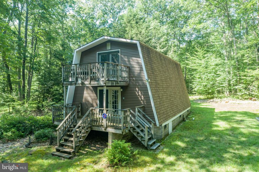 Escape it all with this 2 bedroom mountain retreat situated on 1.2 acres within the Youghiogheny Mountain Resort Community.  This oversized lot provides an abundance of privacy and plenty of room to store all of your mountain toys. You will love the warmth of the wood burning stove on cold evenings and the two large decks during the warmer months. The home has a newer roof and siding. Enjoy the 50+ miles of ATV and hiking trails within the community. Fish at the private river access on both Muddy Creek and the Youghiogheny River.  This is any outdoor lover's paradise!