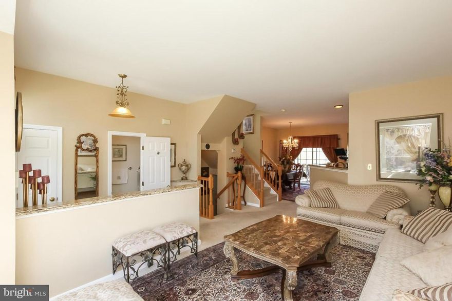 New Year, new price! Amazing updated, 4 level, 4 bed, 3.5 bath end unit town home w/ water view. High end kitchen cabinets w/ quiet close drawers, granite and recessed lighting. Skylights, vaulted ceilings, walk-in closet, crown molding, 2 decks, and a completely finished basement with office and fireplace round out this beauty. In Lake Ridge community and walking distance to the splash park.