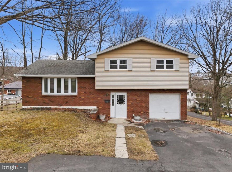 Check out this stunning 4-bedroom split-level gem on a prime corner lot in Frackville – a beautifully renovated, move-in-ready masterpiece loaded with modern upgrades that deliver incredible value! This extensively transformed home offers seamless split-level living with abundant natural light and thoughtful flow across every level, featuring a completely rebuilt kitchen with sleek granite countertops, brand-new cabinetry, stainless steel appliances, and an open layout that effortlessly connects to the dining area and living spaces – ideal for entertaining or effortless everyday meals. Both bathrooms shine with fresh contemporary fixtures, vanities, and lighting for a spa-like vibe. All-new premium flooring (durable LVP on main and lower levels plus plush new carpet in the bedrooms) creates a bright, inviting entry foyer.  Not just 3, but 4  Bedrooms for ultimate flexibility as a guest rooms, home office, home gym, entertainment/bar area, hobby space, or growing household retreat. The layout impresses with a welcoming family room on the entry level (perfect for relaxation, game nights, or cozy movie marathons) with direct attached garage access,  lower-level laundry/utility for added convenience, and sliding doors to a concrete patio overlooking the backyard on this 0.26-acre corner lot. Easy to maintain baseboard electric heat, 200-amp service, nearby community pool access, shopping, and major highways nearby – all wrapped in one of Frackville's updated and versatile renovated homes. This turn-key beauty won't last long – schedule your private showing today and claim your dream home!