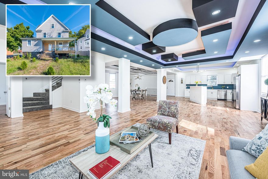 MOTIVATED SELLER!!  SPECTACULAR AND GRAND DESIGNER RENOVATION WITH APPROXIMATELY 5,000 SQ. FT. OF LIVING SPACE!  Features include an open floor plan with gleaming wood floors, rope lighting and custom ceilings throughout the main level, a gourmet island kitchen with Quartz counters & ss appliances, a main level office/den area, 9 bedrooms & 5.5 full baths including an expansive Primary bedroom suite with a spa bath featuring double sinks, a free standing soaking tub, and separate shower, an unfinished basement for storage,   a generously sized rear deck, and parking for multiple cars.  This one has it all!