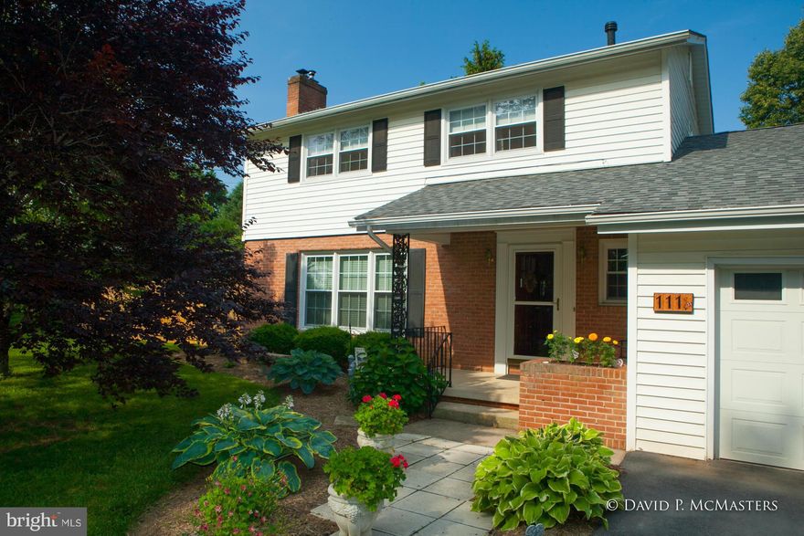 PRICED TO MOVE! Highly attractive, comfortable, well maintained home in convenient location.in Cul-de-sac.  Brick/siding.  Hard wood floors, Kitchen, pine floors, granite counters. Wonderful full basement finished, great built -ins. Deep yard w/mature trees. Partially fenced. Screened porch. 4 br, large family room w/fr pl, frpl with pellet stove, new roof 2014. Well landscaped. Possible 5th BR.