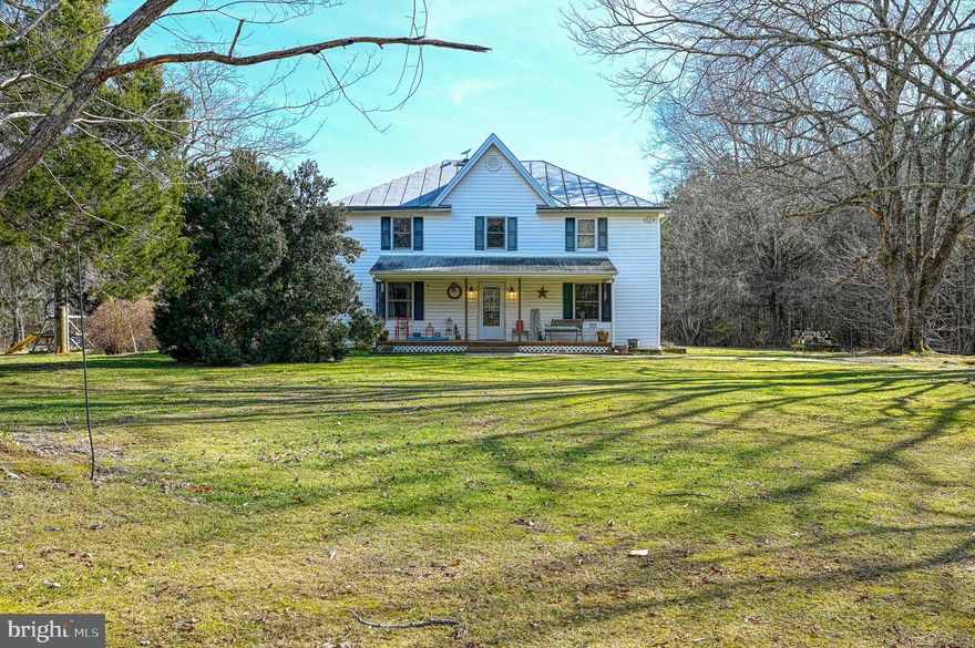 Discover the charm of country living with this beautiful farmhouse nestled on almost 13 acres in a serene setting! The main floor offers a welcoming space to entertain family and friends in the kitchen and dining room, while the family and living rooms provide cozy spots to relax. Upstairs you will find 4 spacious bedrooms featuring wood floors, perfect for a growing family or guests. The property includes a detached garage with electric, a pole barn and plenty of open space ideal for gardening or raising farm animals. Don't miss your chance to own this slice of country paradise!