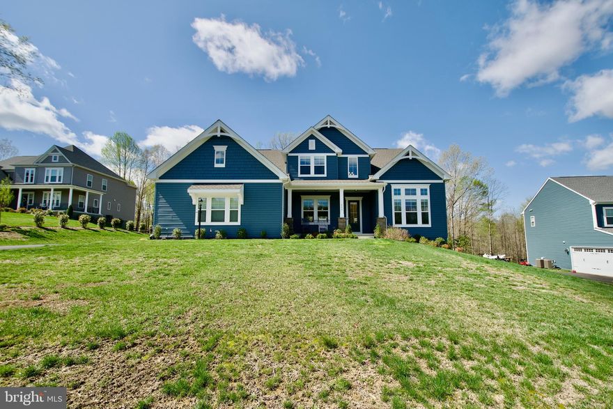 The Peacefield model is a classic home with modern luxuries.  Step inside and be greeted by an open floor plan that effortlessly combines contemporary design with  comfort. The gourmet kitchen, stainless steel appliances and a spacious island, is perfect for entertaining, cozy up by the fireplace in the living room. The main level primary bedroom offers tranquil sanctuary with a spa like ensuite bathroom and a walk in closet. A acre and half of land provide ample space for outdoor activities and relaxation,  the serene views of nature from your backyard.  Many upgrade features are window treatments, fans,  presently there is an electric stove top-but  equipped with gas line is available for a gas stove top, LL has rough ins for full bath and wet bar. A few miles from I-95, easy access to the HOV lanes for an easy commute, and  VRE station.