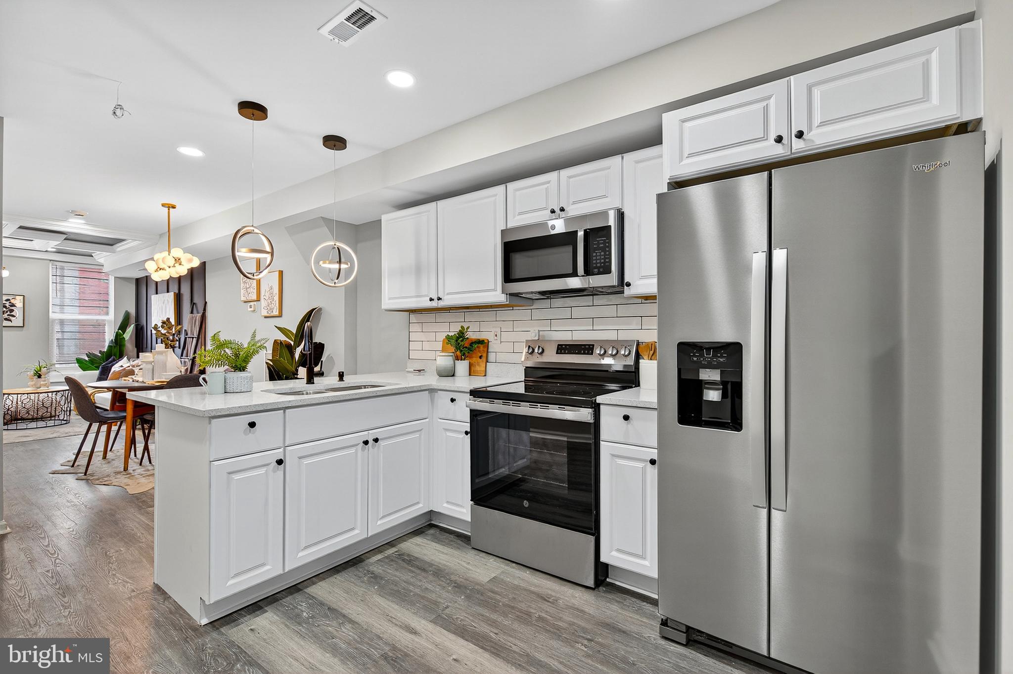 Step inside this fully renovated townhouse and discover the perfect blend of modern luxury and urban convenience. This exceptional home features three spacious bedrooms, plus a private master suite, offering an ideal layout for families or those who desire extra space. With two full bathrooms on the upper levels, one showcasing a stunning, tiled walk-in shower with gold-accented fixtures, and a convenient half bathroom on the main level, comfort and functionality are at the forefront of this design.
The heart of the home is a stunning kitchen, equipped with brand-new stainless steel appliances, crisp white cabinetry, and elegant finishes that make cooking and entertaining a joy. The open floor plan flows seamlessly from the kitchen to the living and dining areas, creating a bright and inviting atmosphere with modern touches like a sleek coffered ceiling and a striking accent wall.
Venture outside to your private backyard, a tranquil retreat perfect for relaxing after a long day or hosting summer barbecues. The location is truly unbeatable, with Carroll Park just a short stroll away, providing ample green space and recreational opportunities. For commuters, the home offers incredible access, situated moments from both Route 40 and I-95, making travel in and out of the city effortless.
This is more than just a house; it's a meticulously crafted home that offers a sophisticated lifestyle in a vibrant, sought-after neighborhood. Don't miss your chance to own this urban gem.